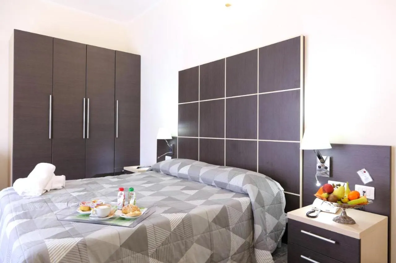 Bed in Hotel Vitruvio