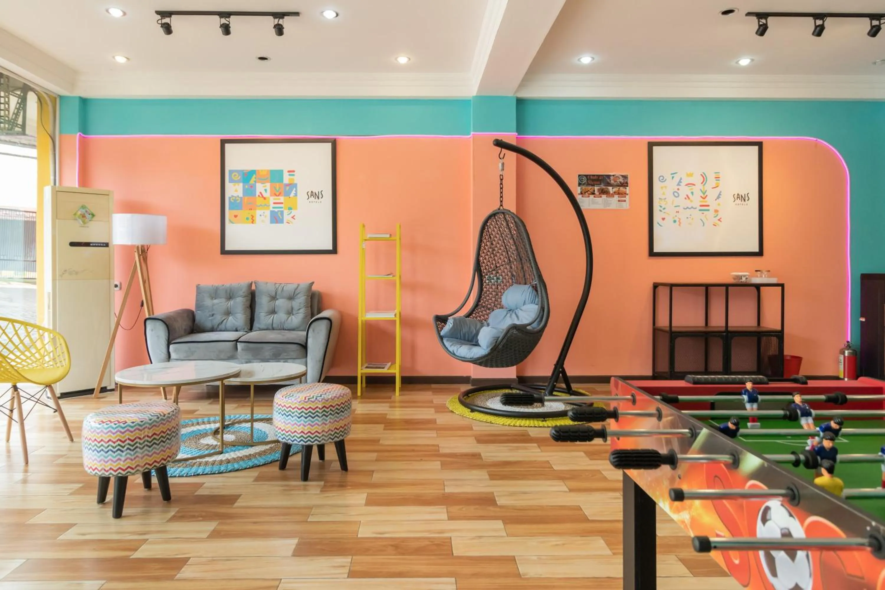 Seating area in Sans Hotel Beauty Palembang