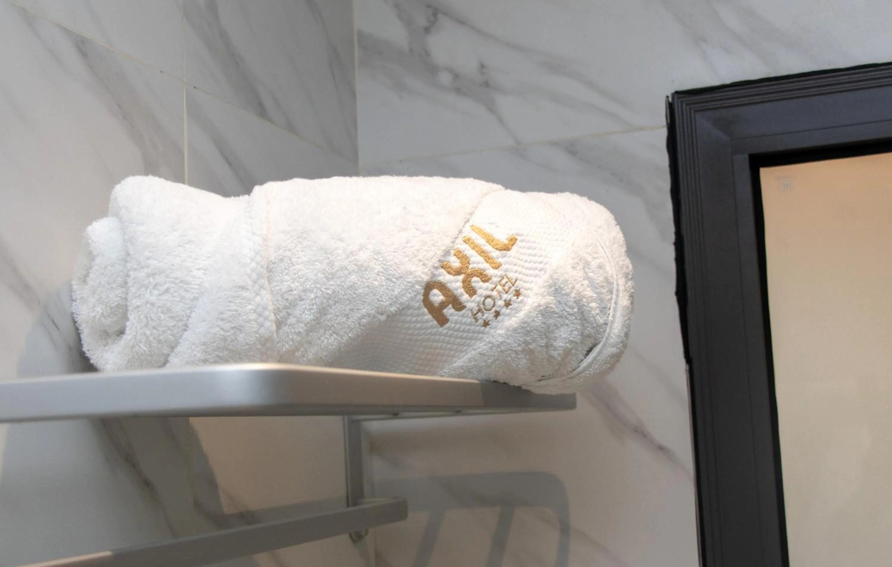 towels, Bed in AXIL HÔTEL