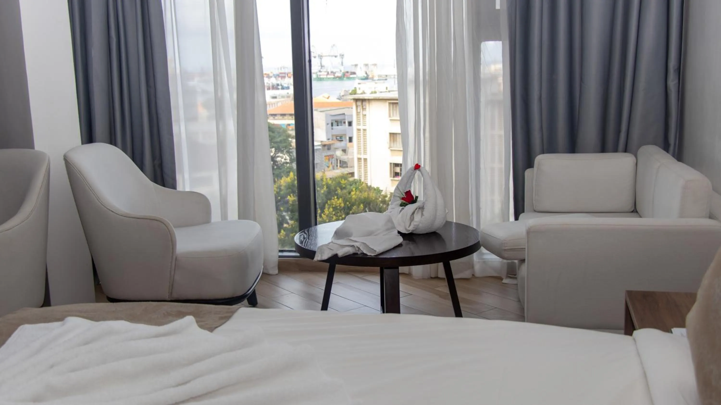 Living room, Bed in AXIL HÔTEL