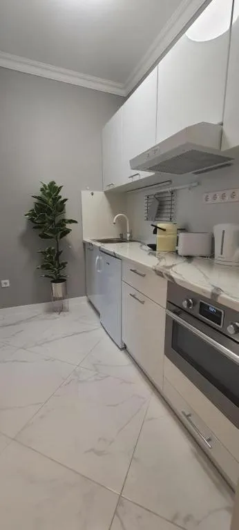 Kitchen or kitchenette in Camille Apartmanhouse