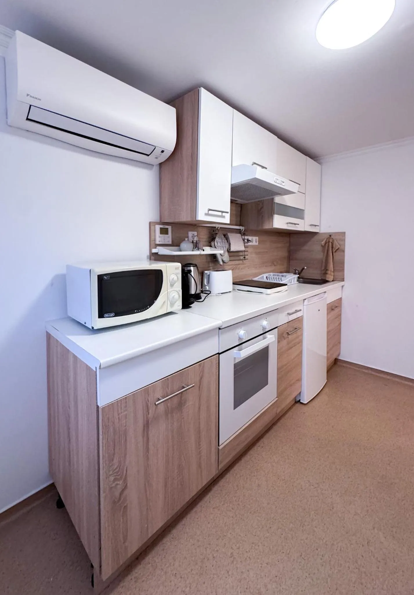 Kitchen or kitchenette in Camille Apartmanhouse