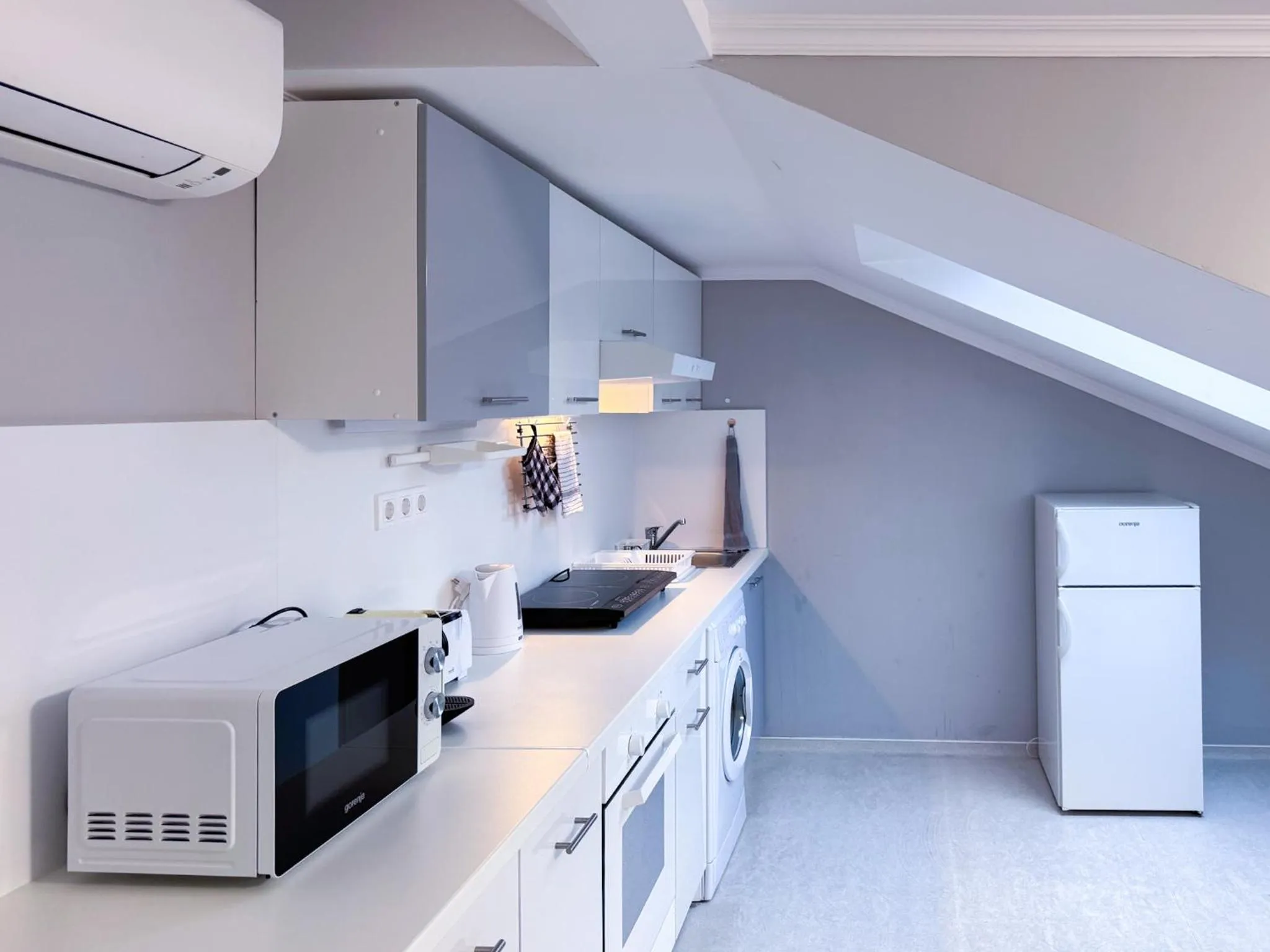 Kitchen or kitchenette in Camille Apartmanhouse