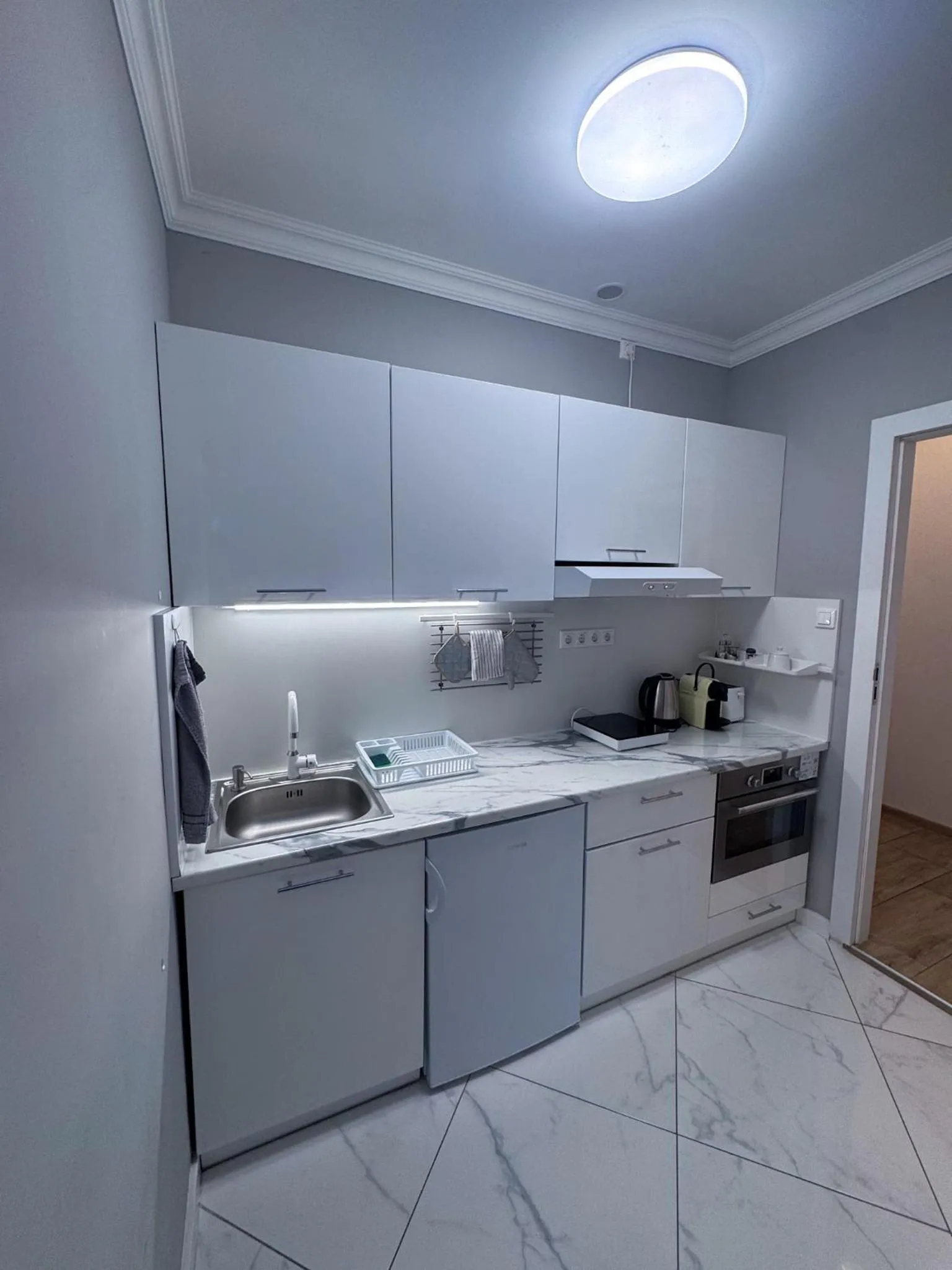 Kitchen or kitchenette in Camille Apartmanhouse