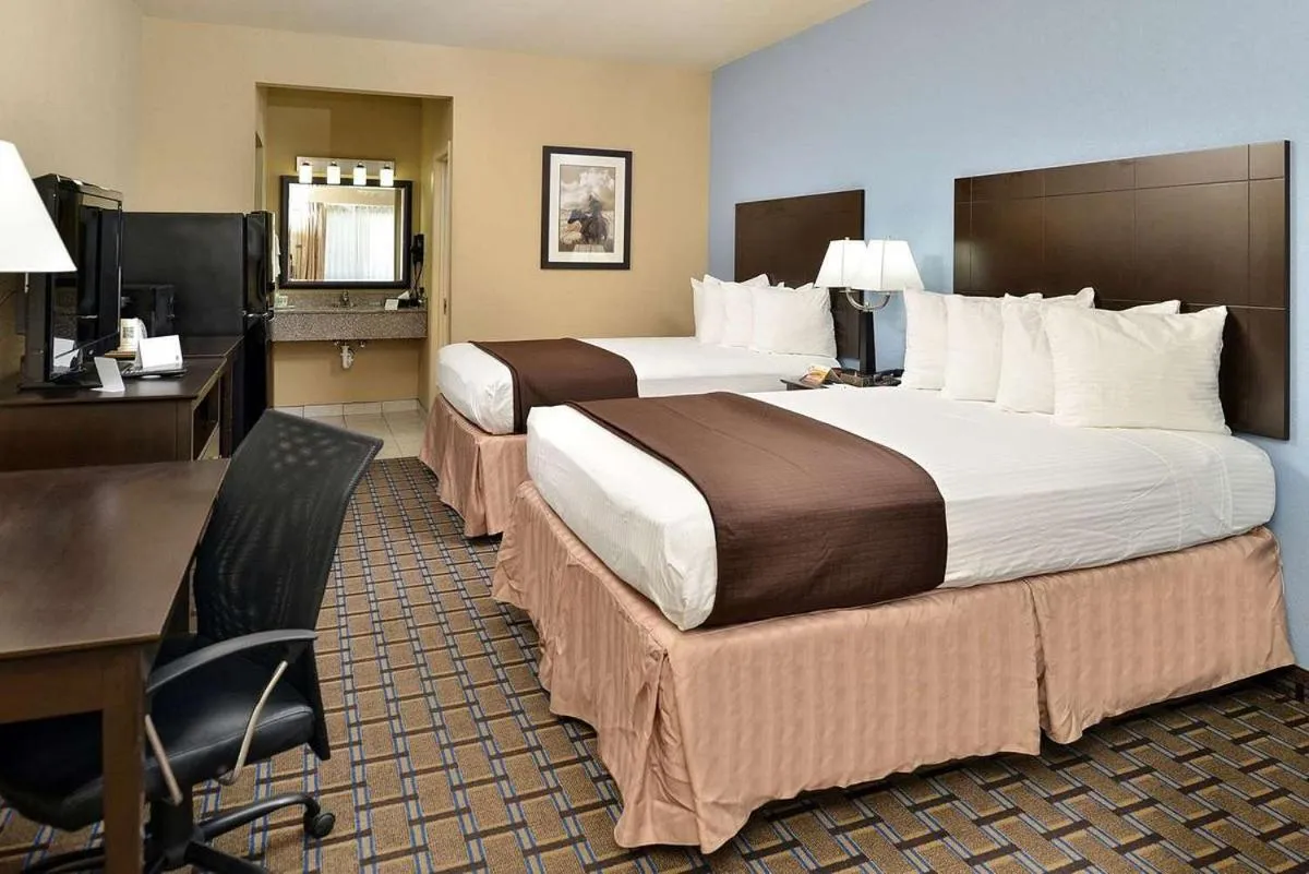 Bed in Western Inn & Suites