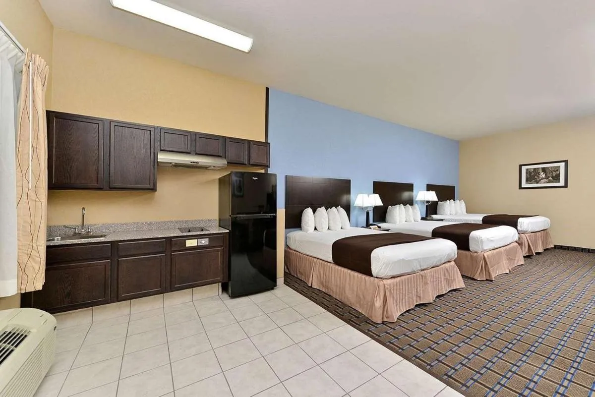 Bed in Western Inn & Suites