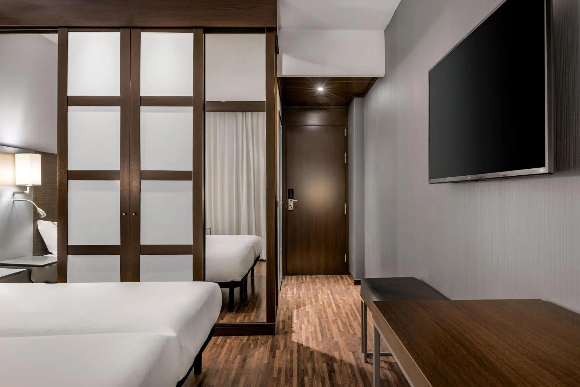 Bed in AC Hotel by Marriott Pisa