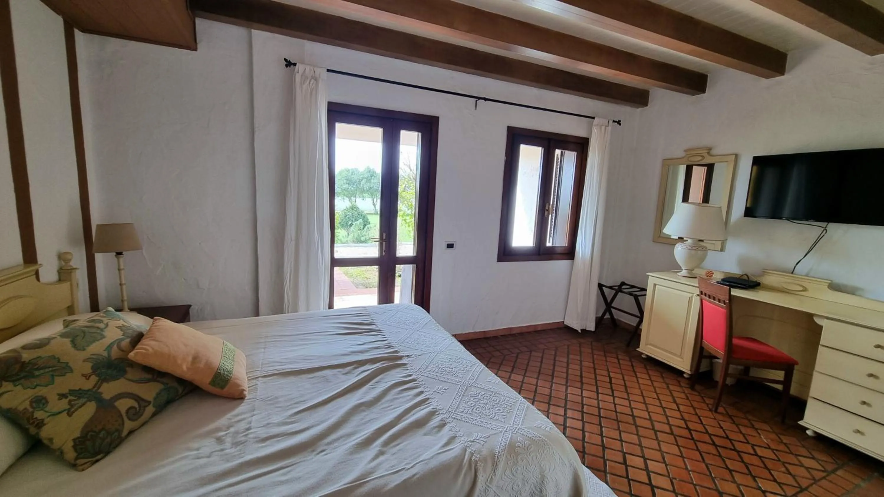 Patio, Bed in Is Benas Country Lodge