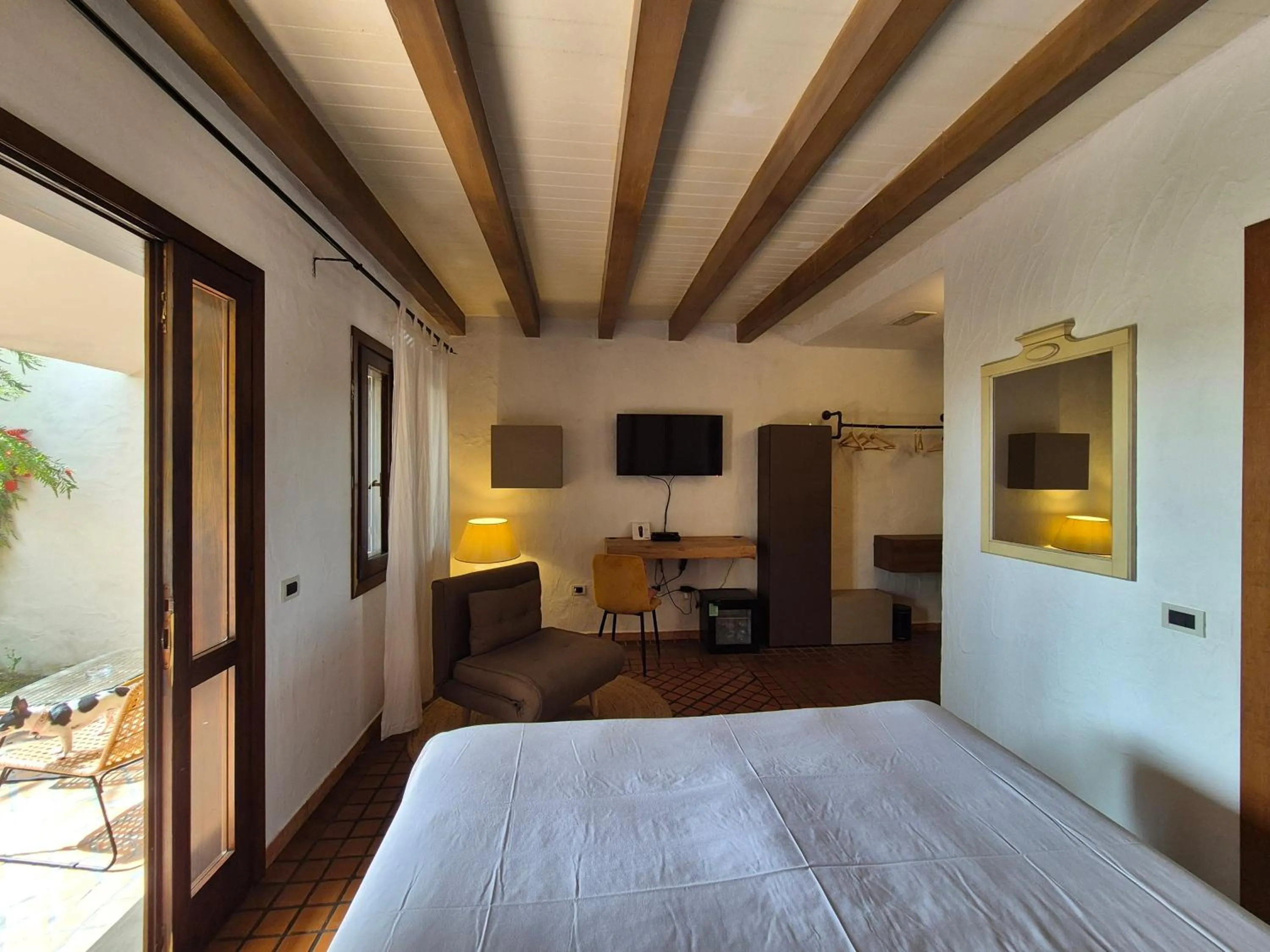 Bed in Is Benas Country Lodge