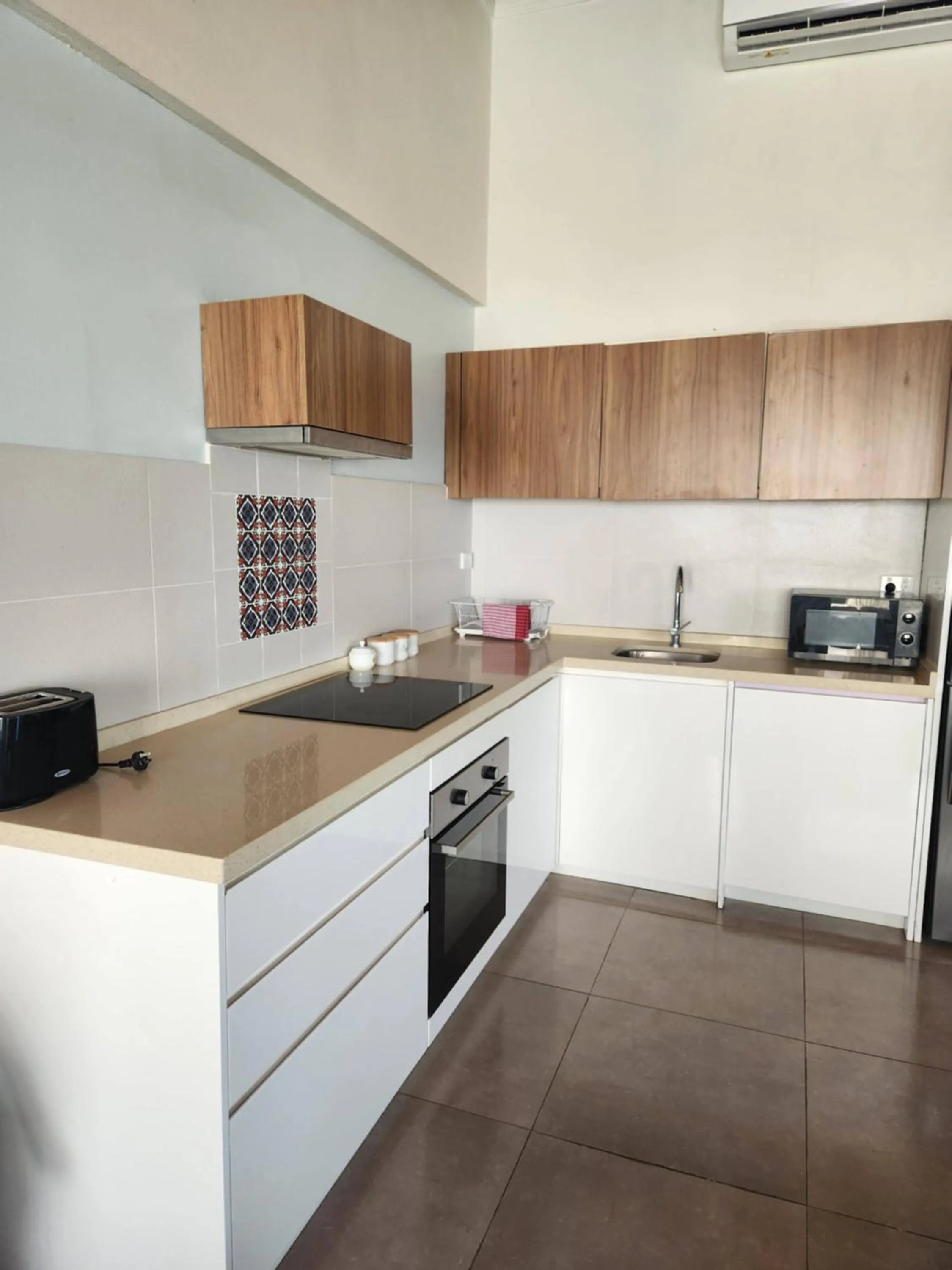 Kitchen or kitchenette in Ramada Suites By Wyndham Seafront Coral Coast