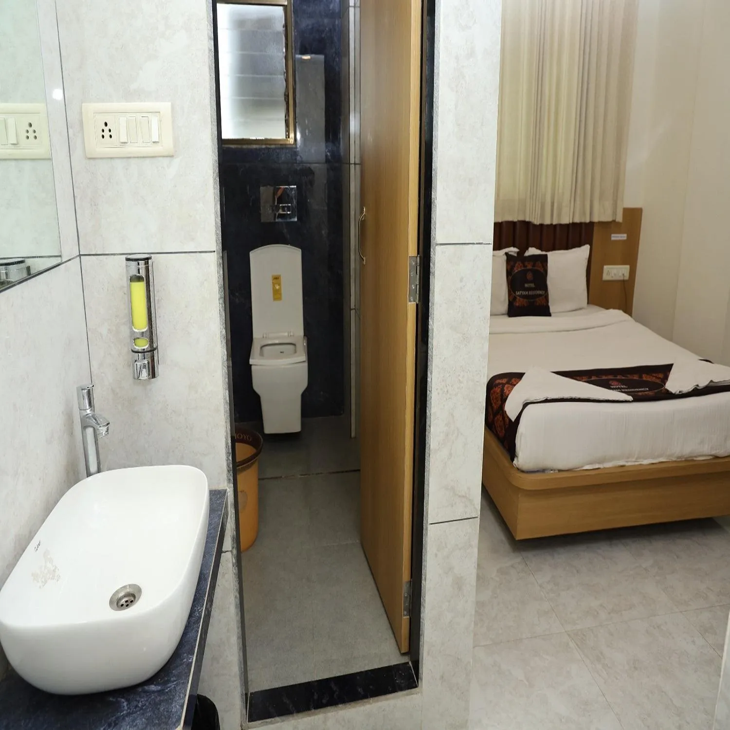 Toilet, Bed in Hotel Satyam Residency