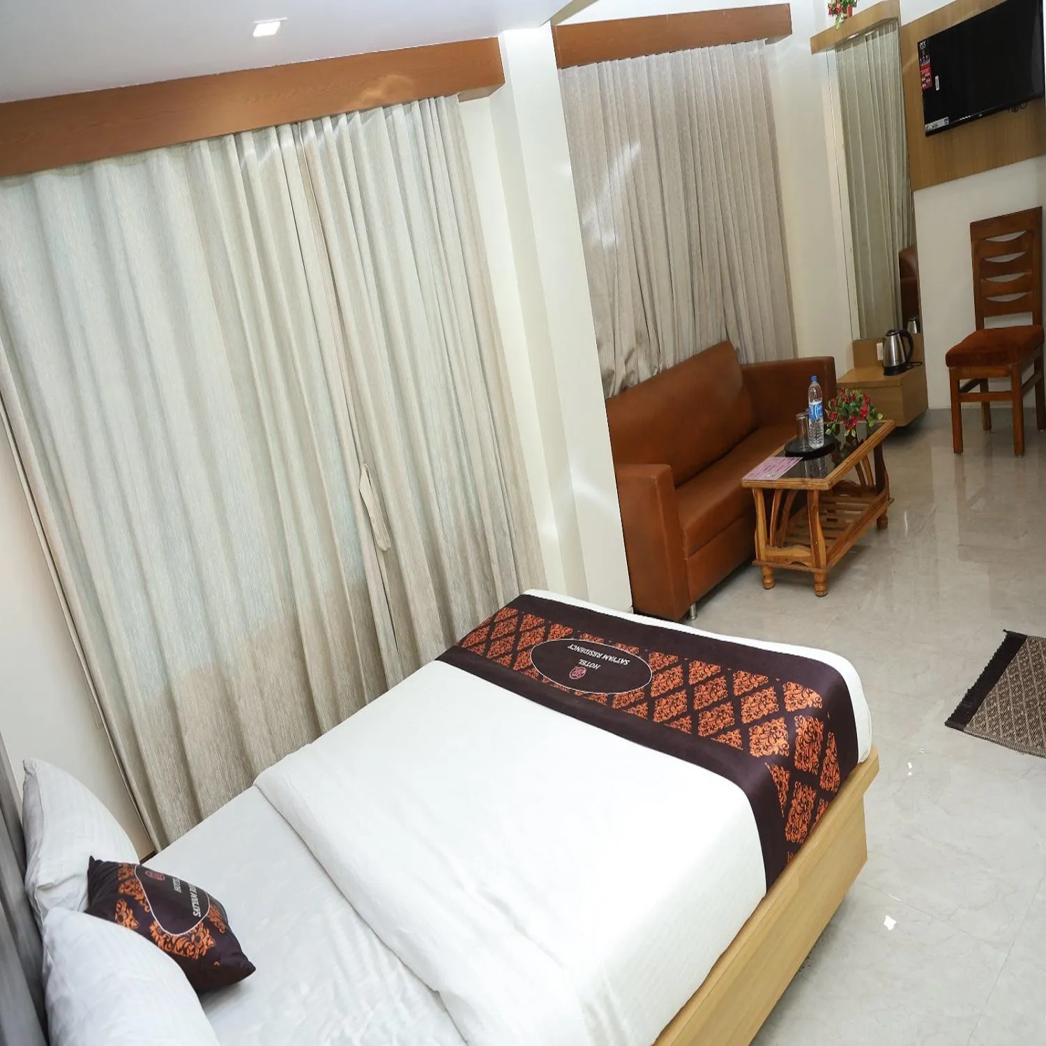 Bed in Hotel Satyam Residency