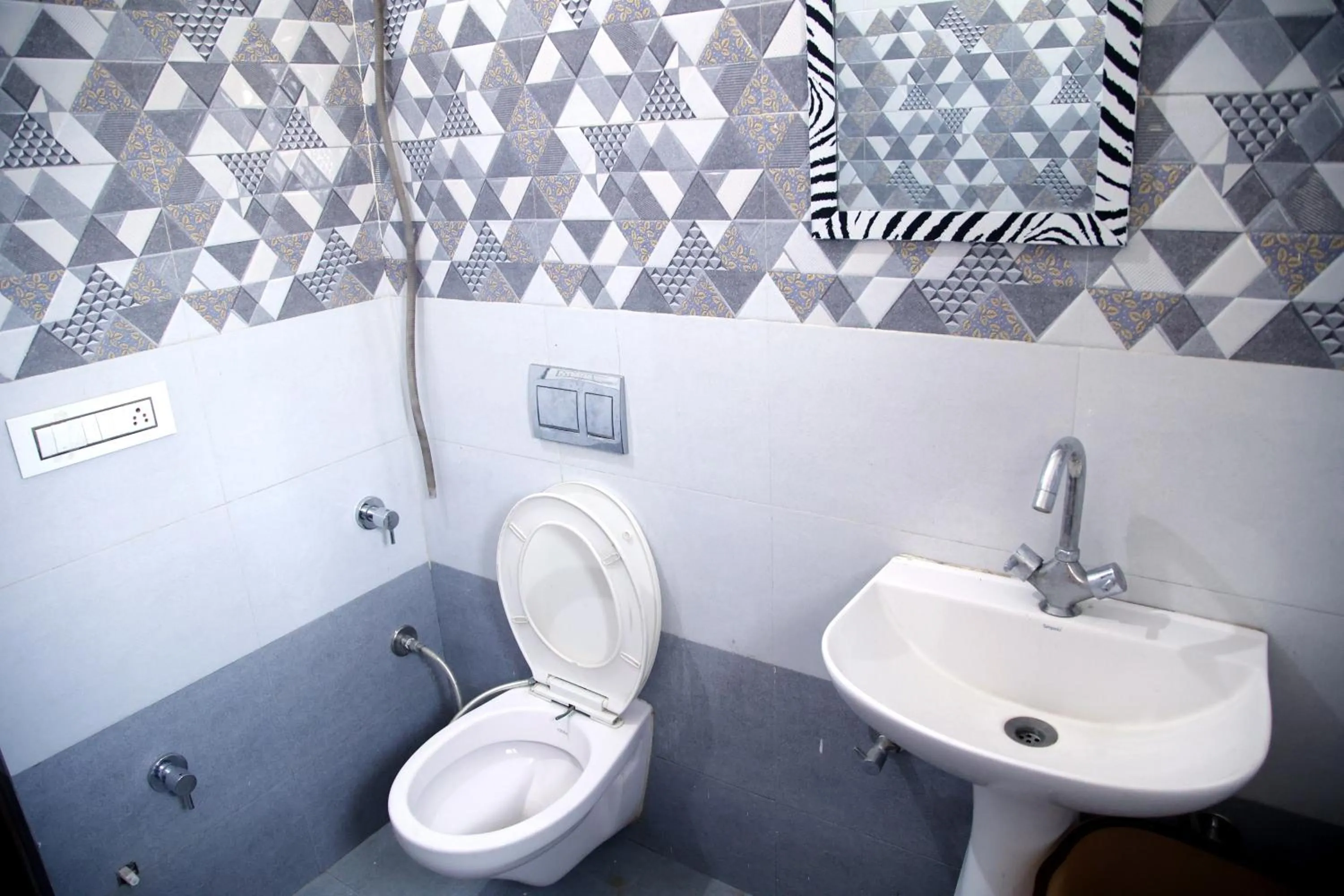 Bathroom in Hotel O Galaxy Stays