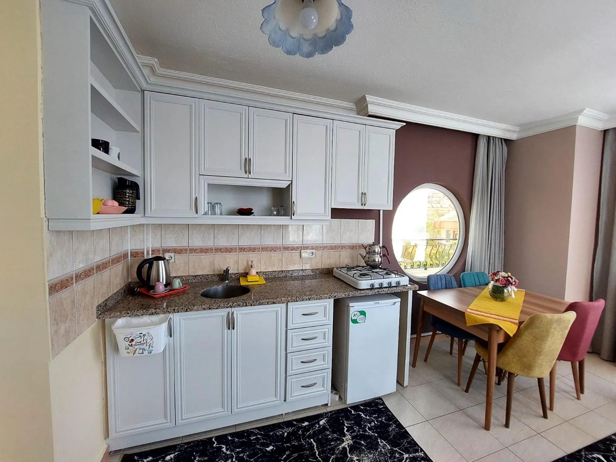 Kitchen or kitchenette in Summer rose hotel