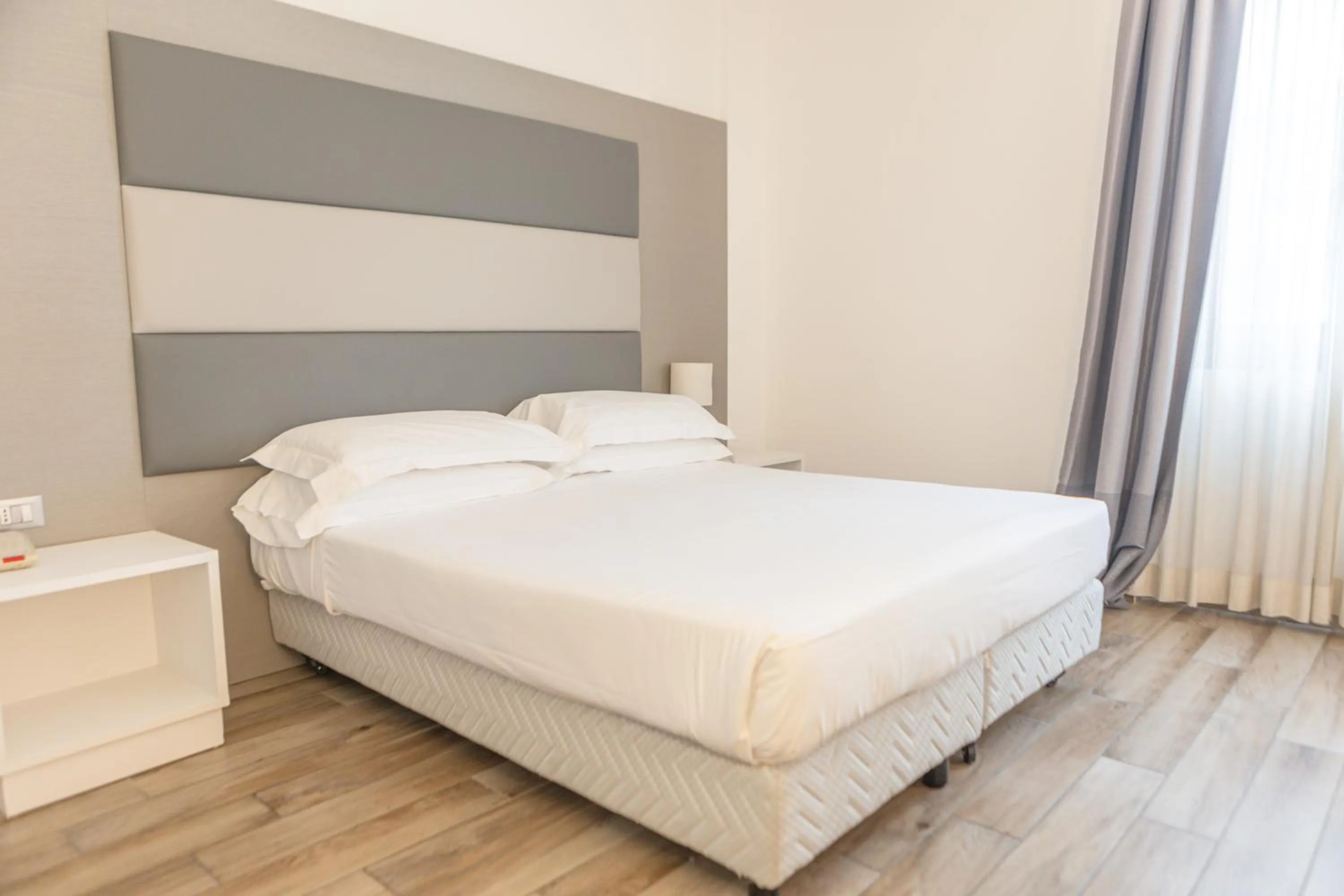 Bed in Toscana Ambassador