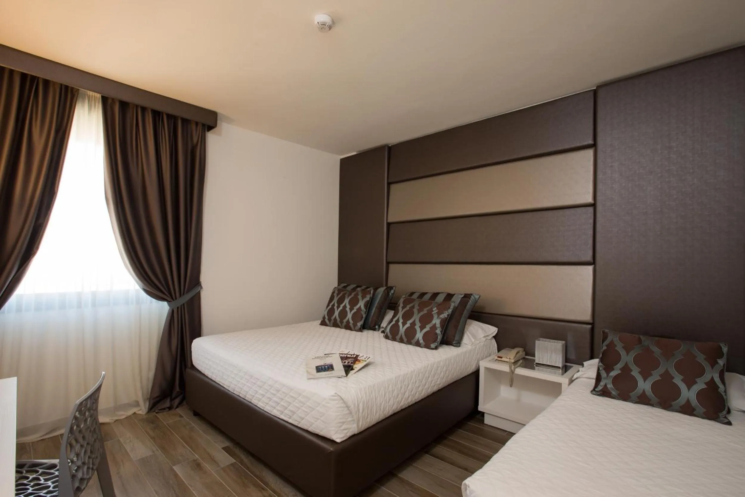 Bed in Toscana Ambassador