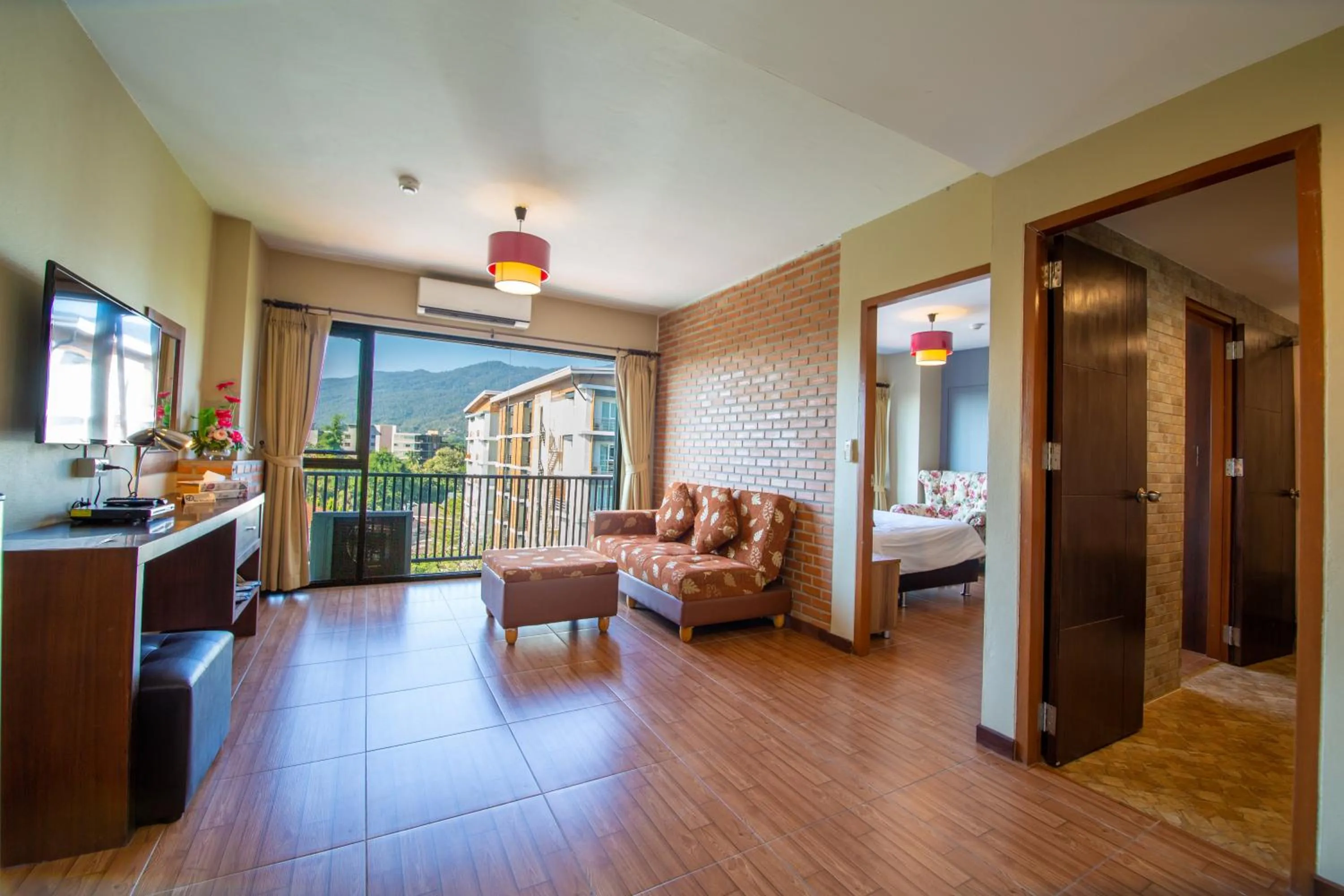 Living room, Bed in WE Valley Hotel