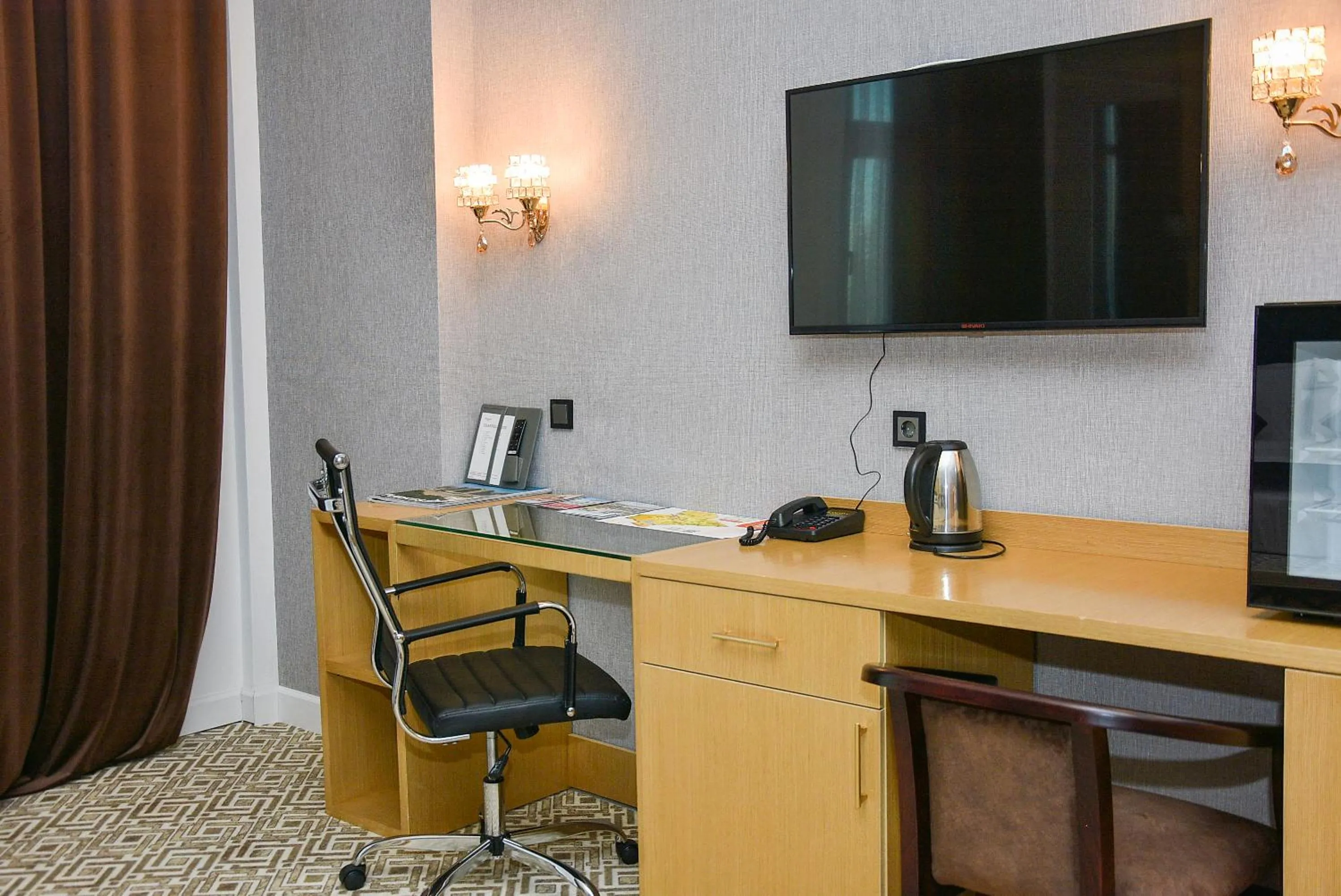 Communal lounge/ TV room in Ramada by Wyndham Turkistan