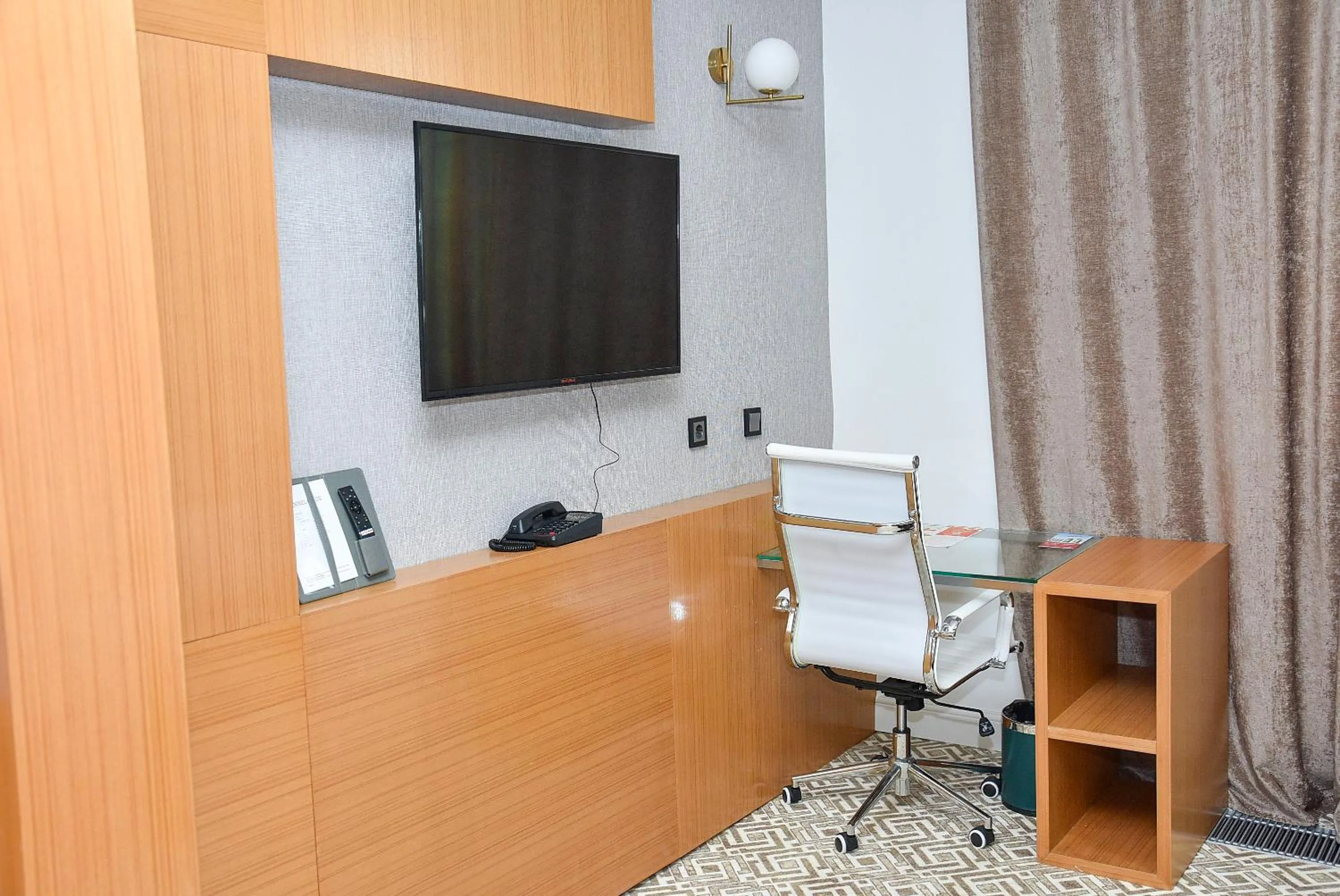 TV and multimedia in Ramada by Wyndham Turkistan