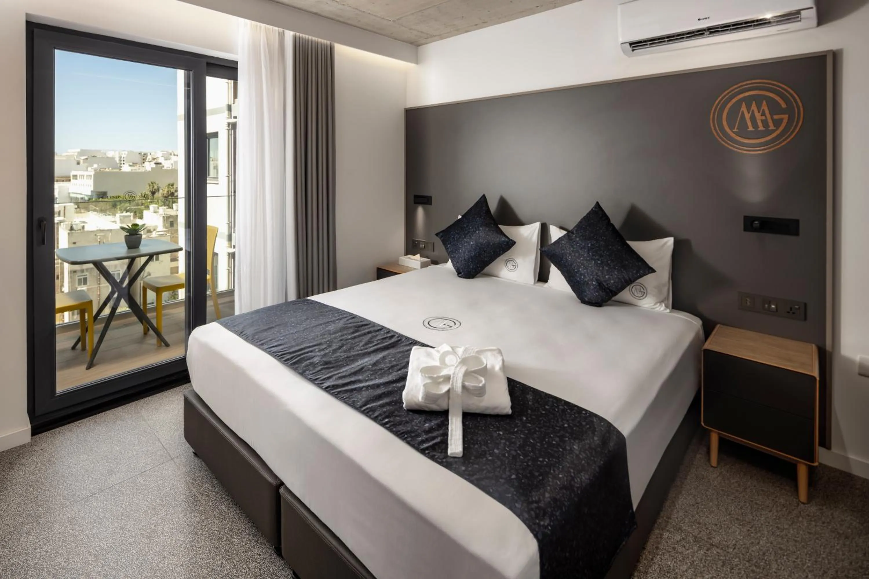 Bed in Grands Suites Hotel and Spa Sliema