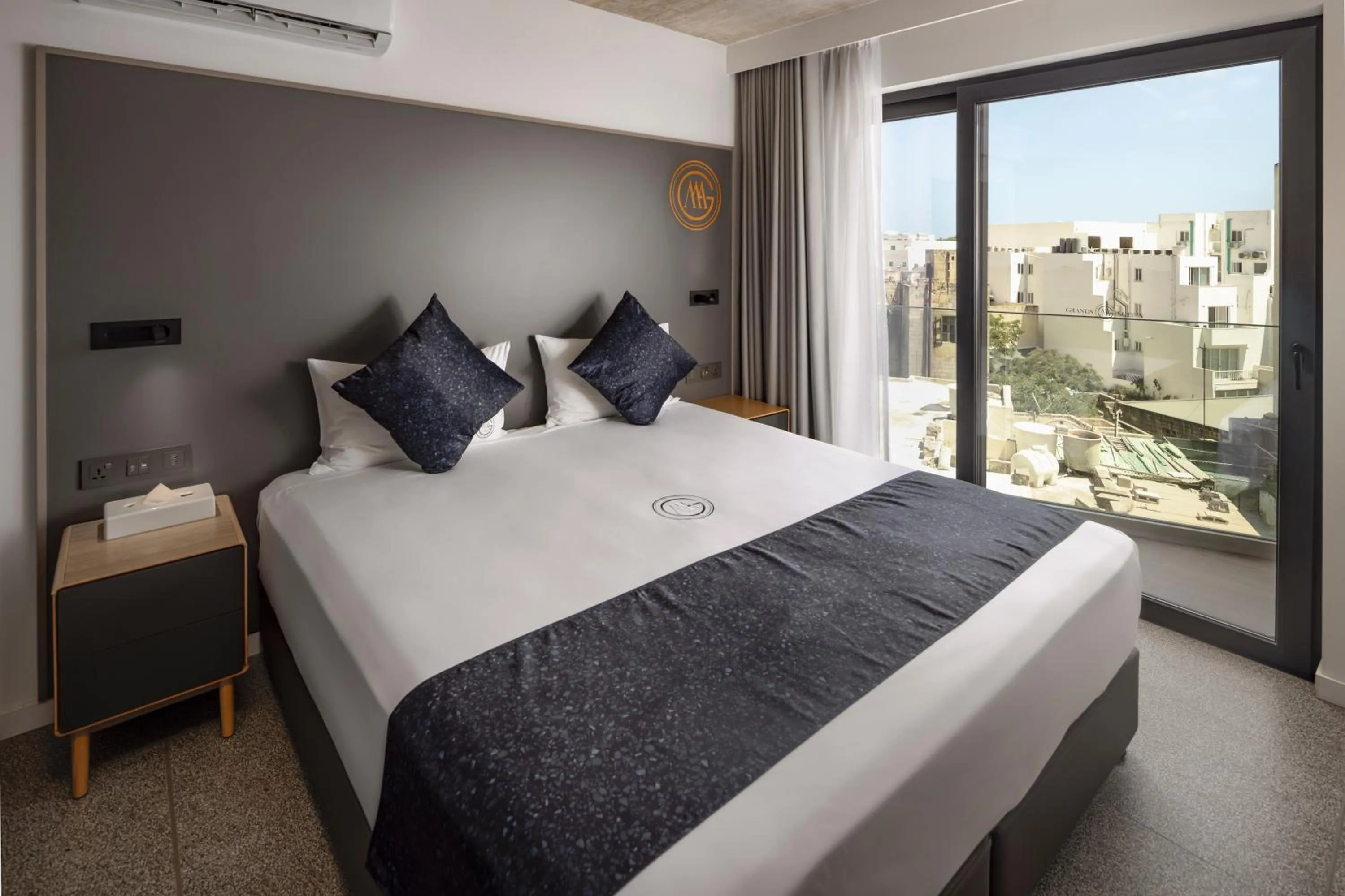 Bed in Grands Suites Hotel and Spa Sliema