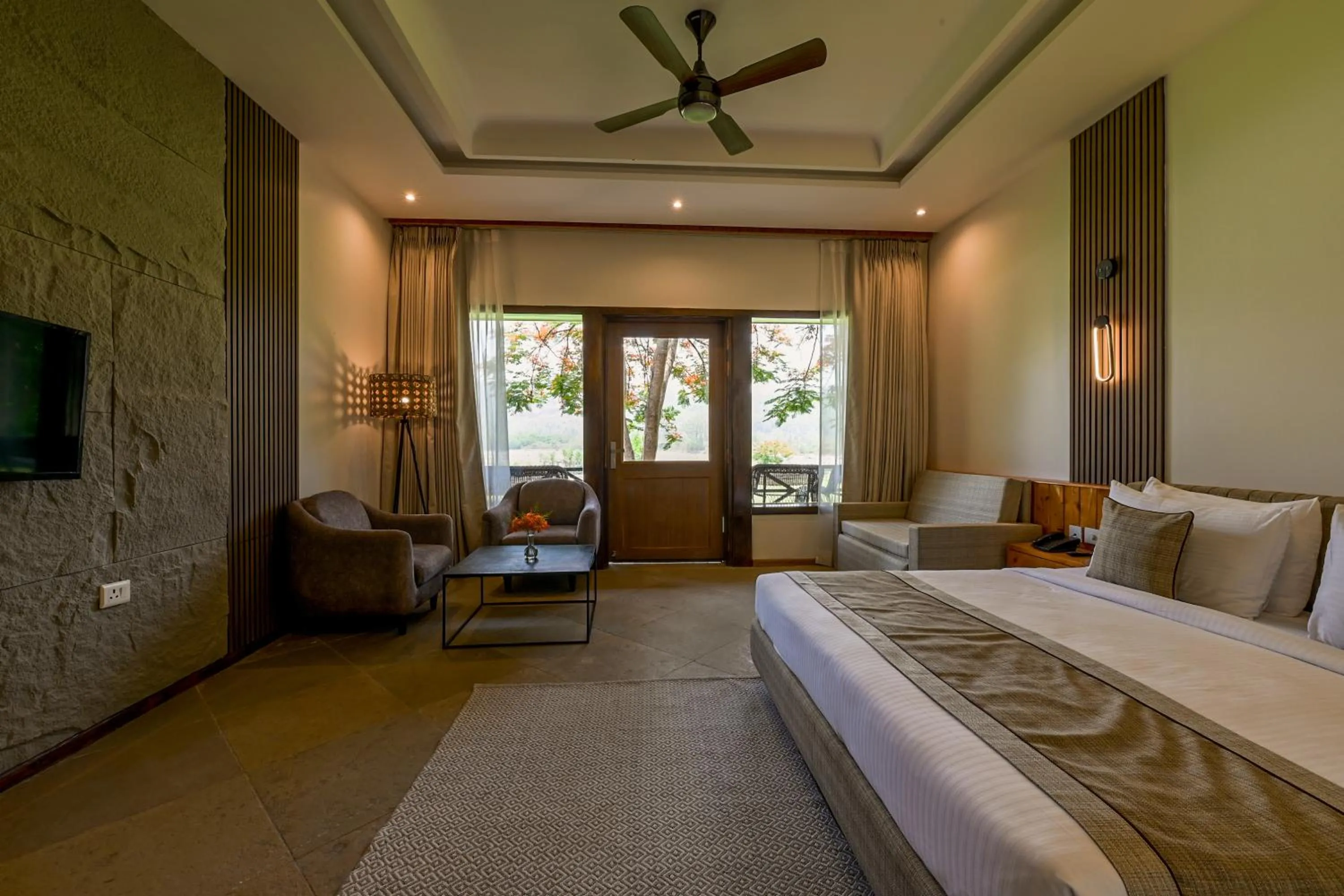 Seating area, Bed in Tarangi Resort and Spa