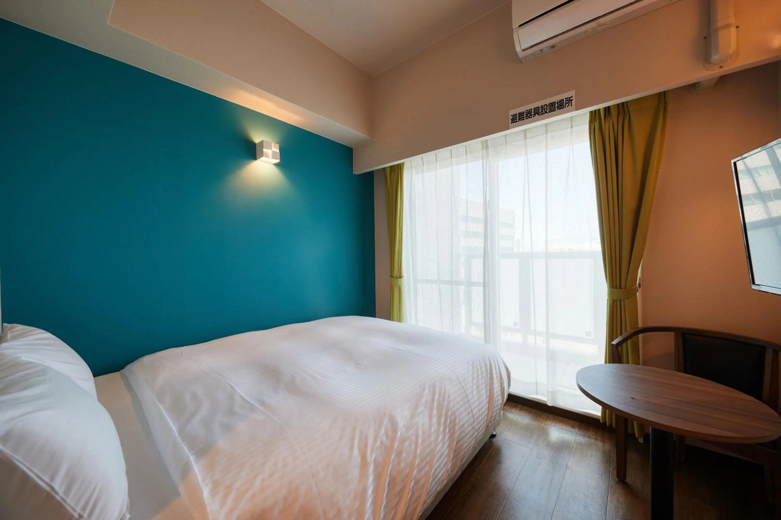 Bed in New Normal Condo in NAHA AIRPORT ニューノーマルコンドイン那覇エアポート