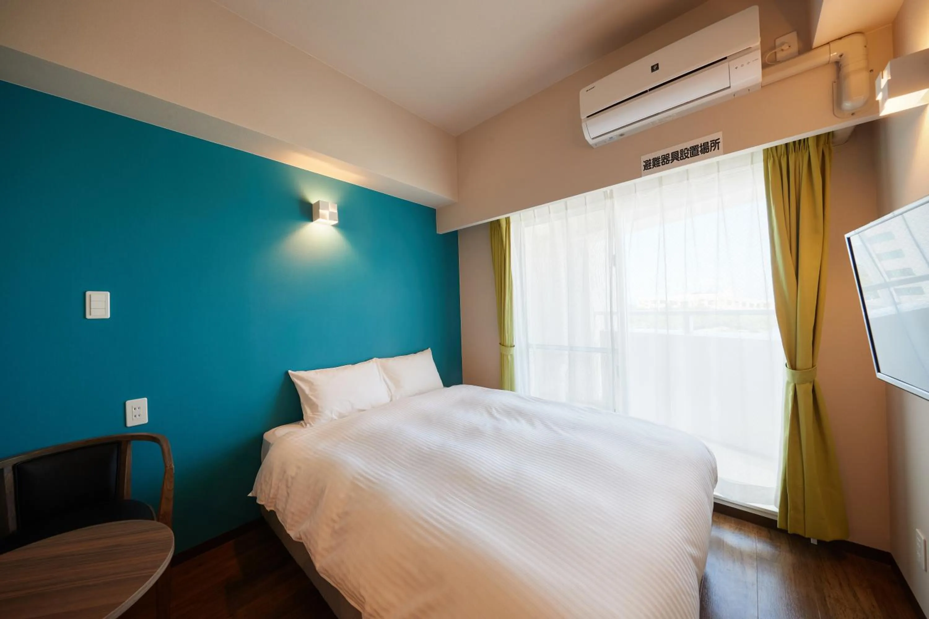 Bed in New Normal Condo in NAHA AIRPORT ニューノーマルコンドイン那覇エアポート