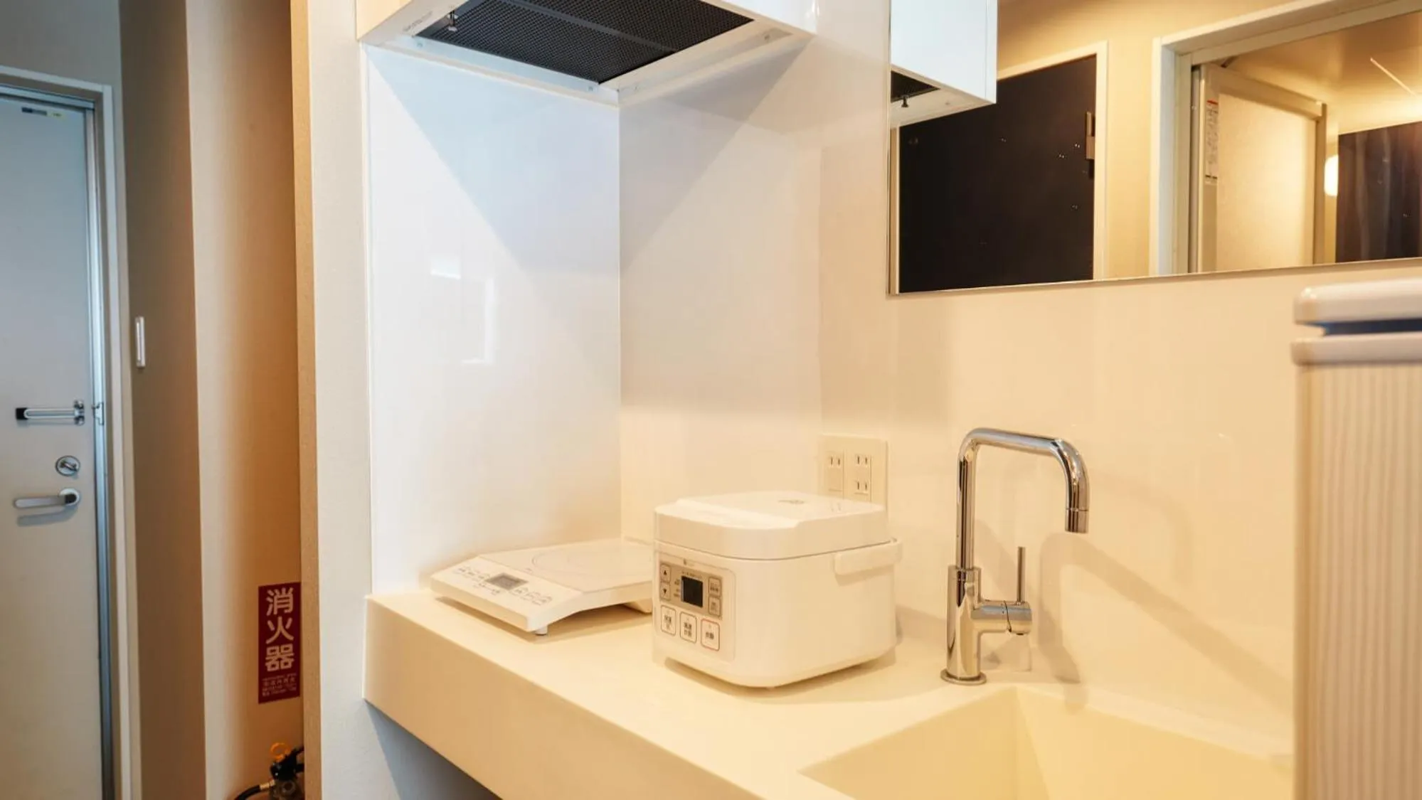 Kitchen or kitchenette in New Normal Condo in NAHA AIRPORT ニューノーマルコンドイン那覇エアポート