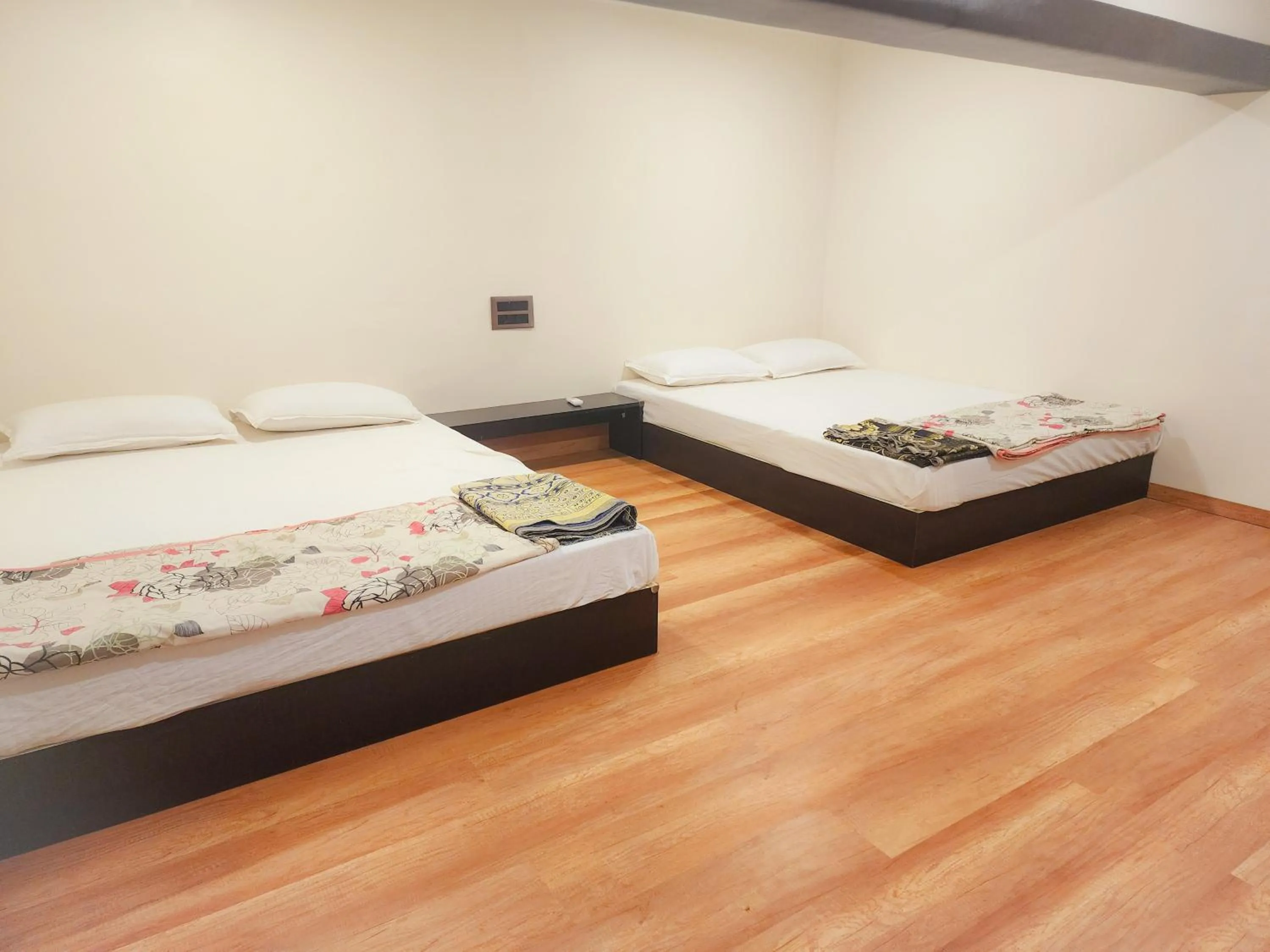 Bed in Passiflora Beach Resort Alibaug