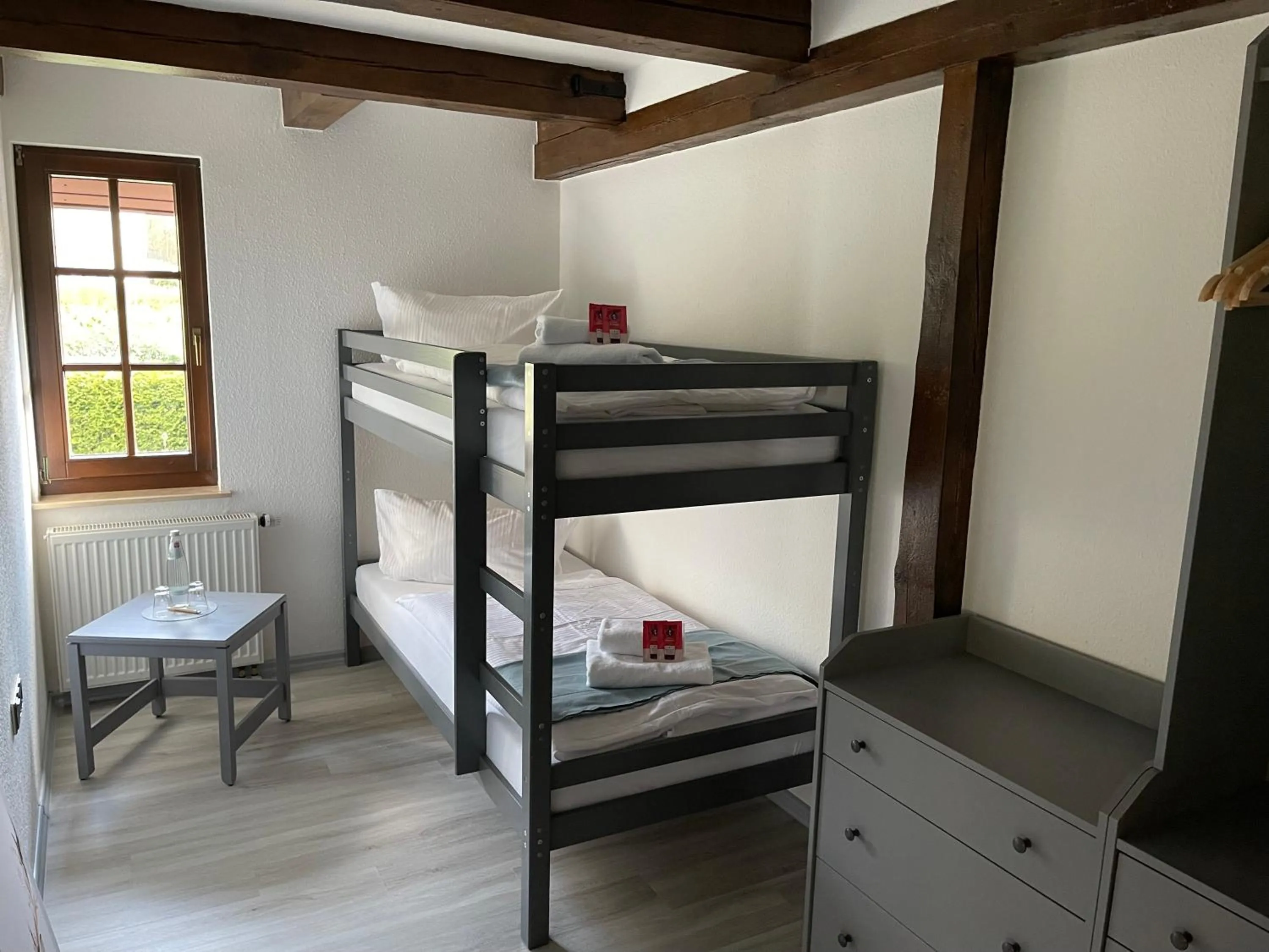 Bed in Landhotel Der Distelhof mit Scheunencafé