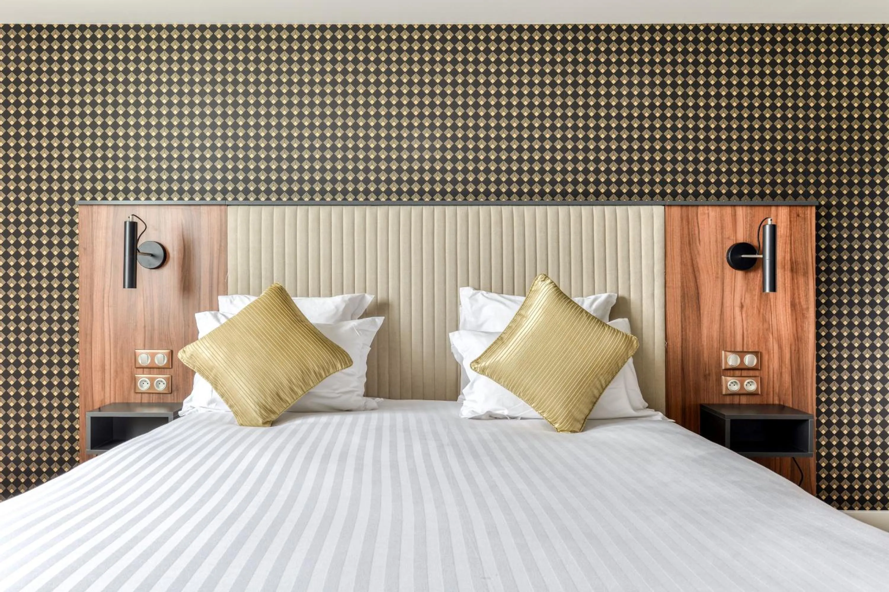 Bed in Zenitude Hotel La Valadière, Ascend Hotel Collection