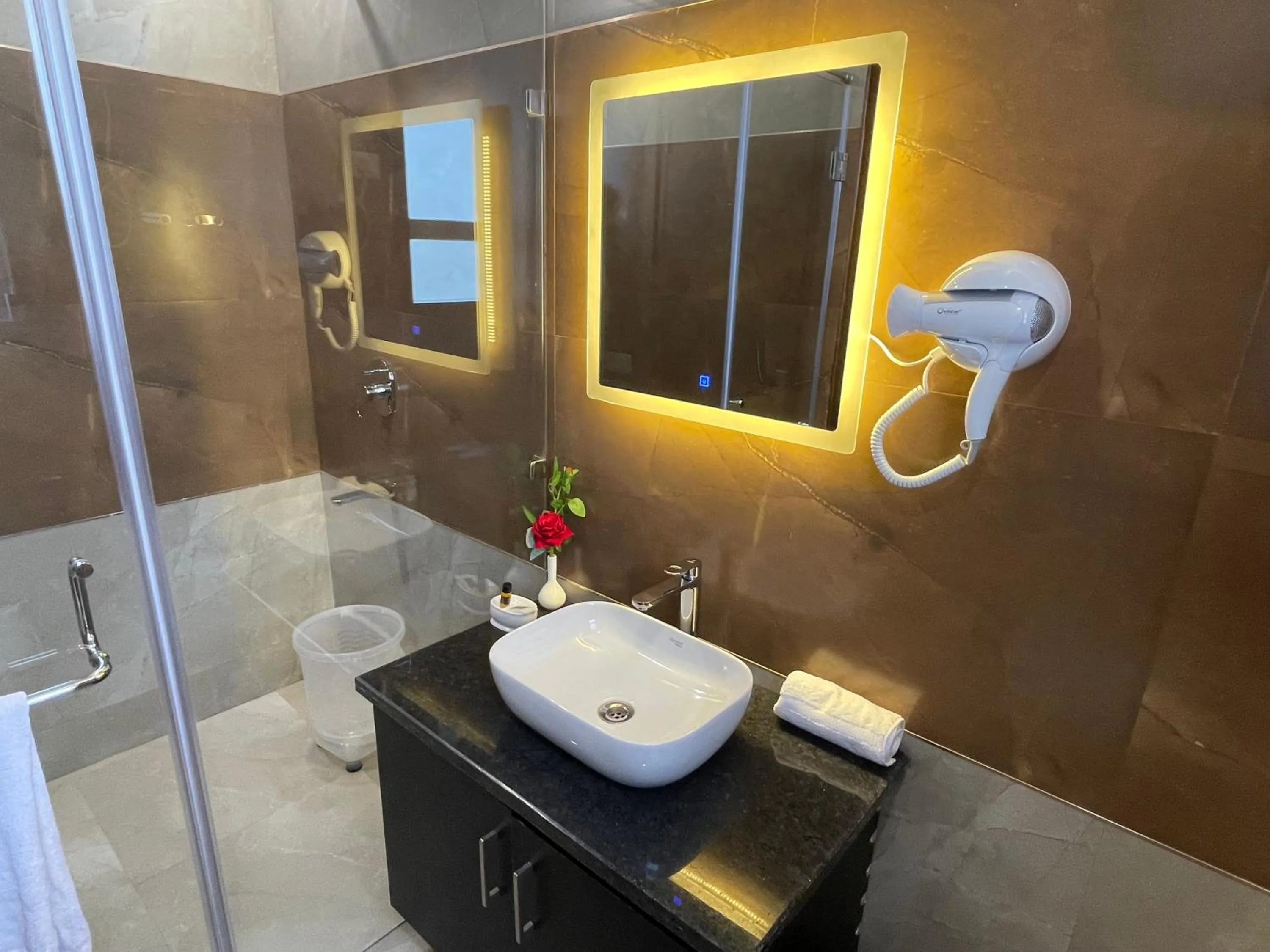 Bathroom in Hotel Malbork Inn Rajouri Garden Delhi - Couple Friendly Local IDs Accepted