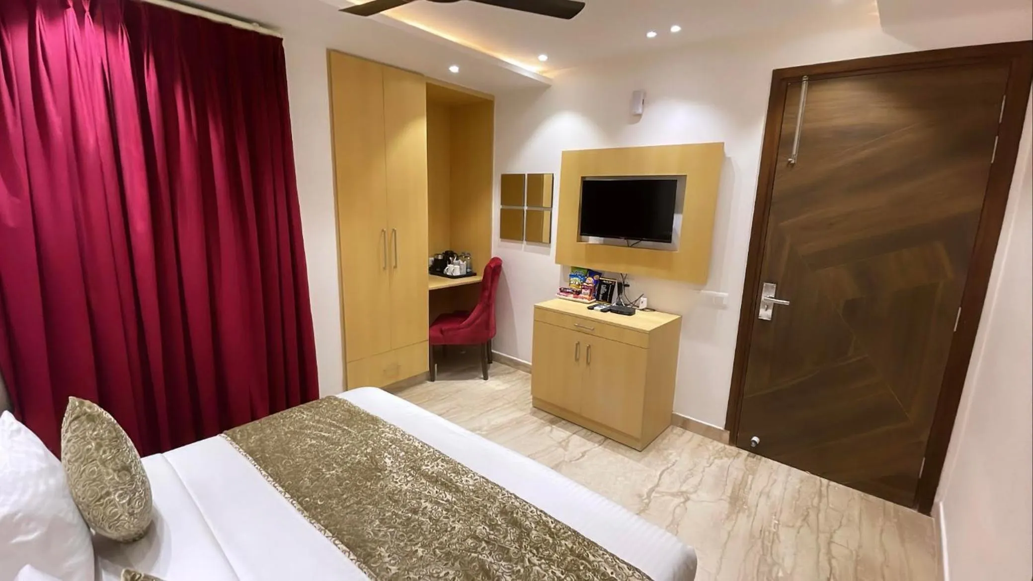 Photo of the whole room, Bed in Hotel Malbork Inn Rajouri Garden Delhi - Couple Friendly Local IDs Accepted