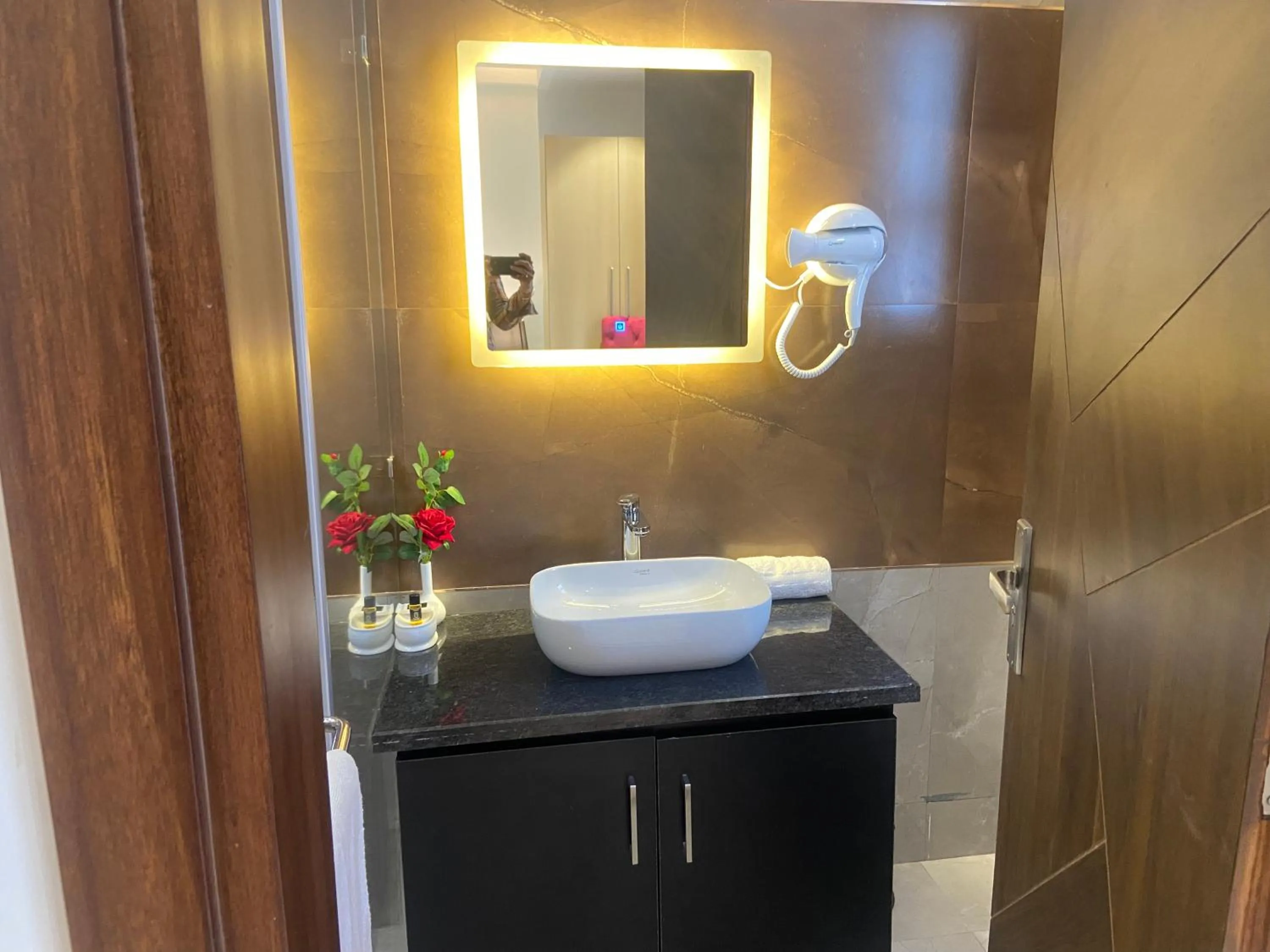 Bathroom in Hotel Malbork Inn Rajouri Garden Delhi - Couple Friendly Local IDs Accepted