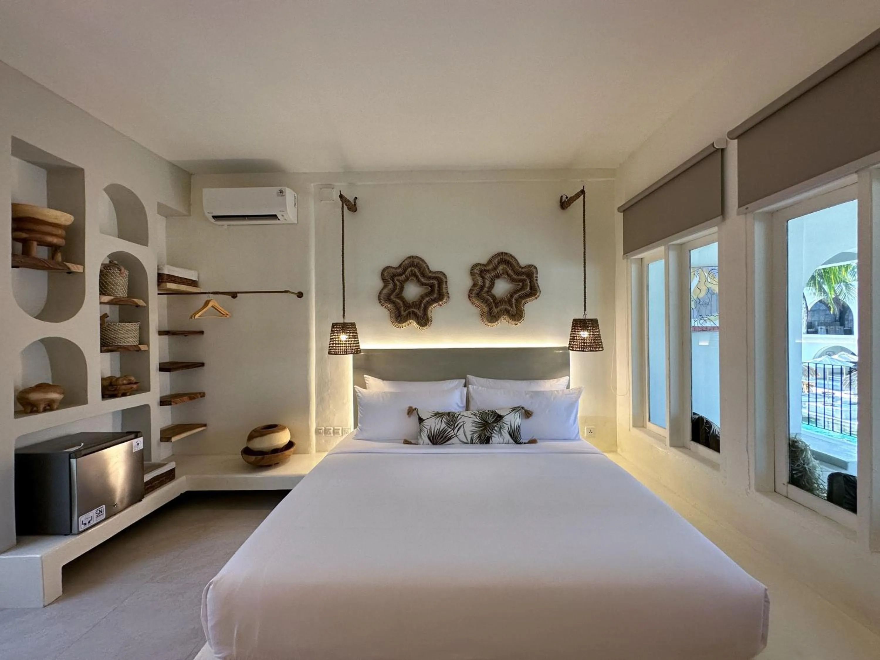 Bed in El Tropico Boutique Hotel