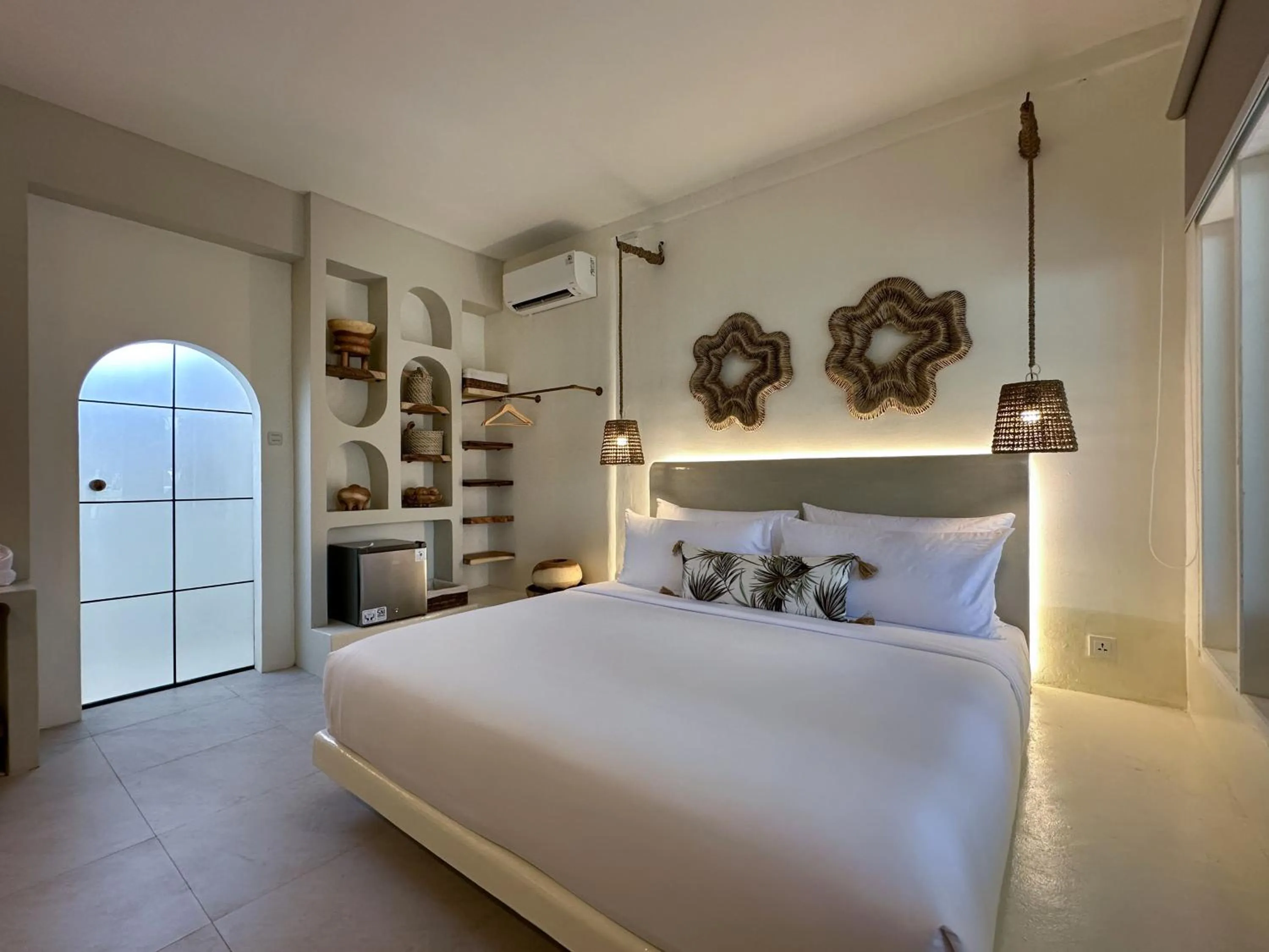 Bed in El Tropico Boutique Hotel