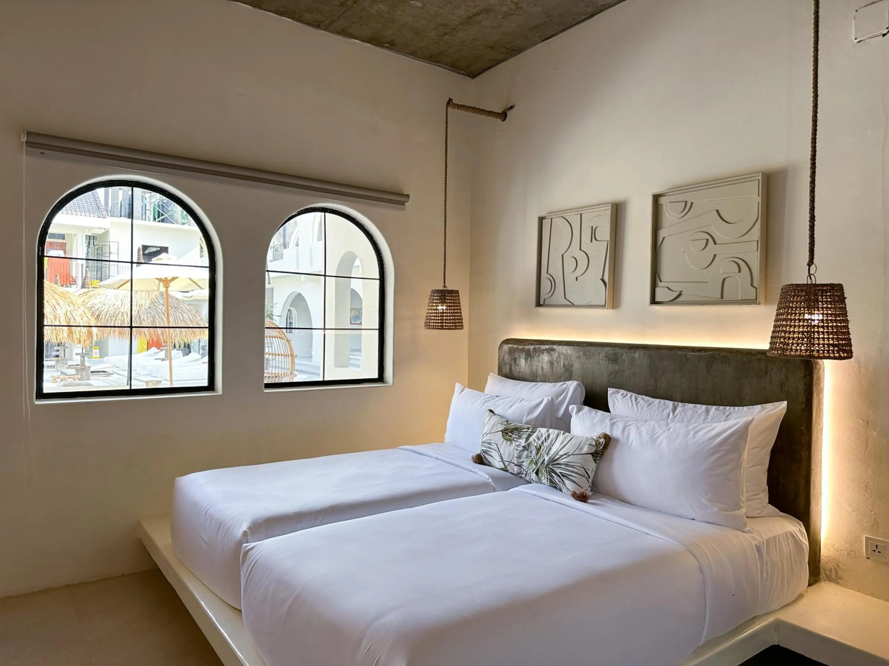 Bed in El Tropico Boutique Hotel