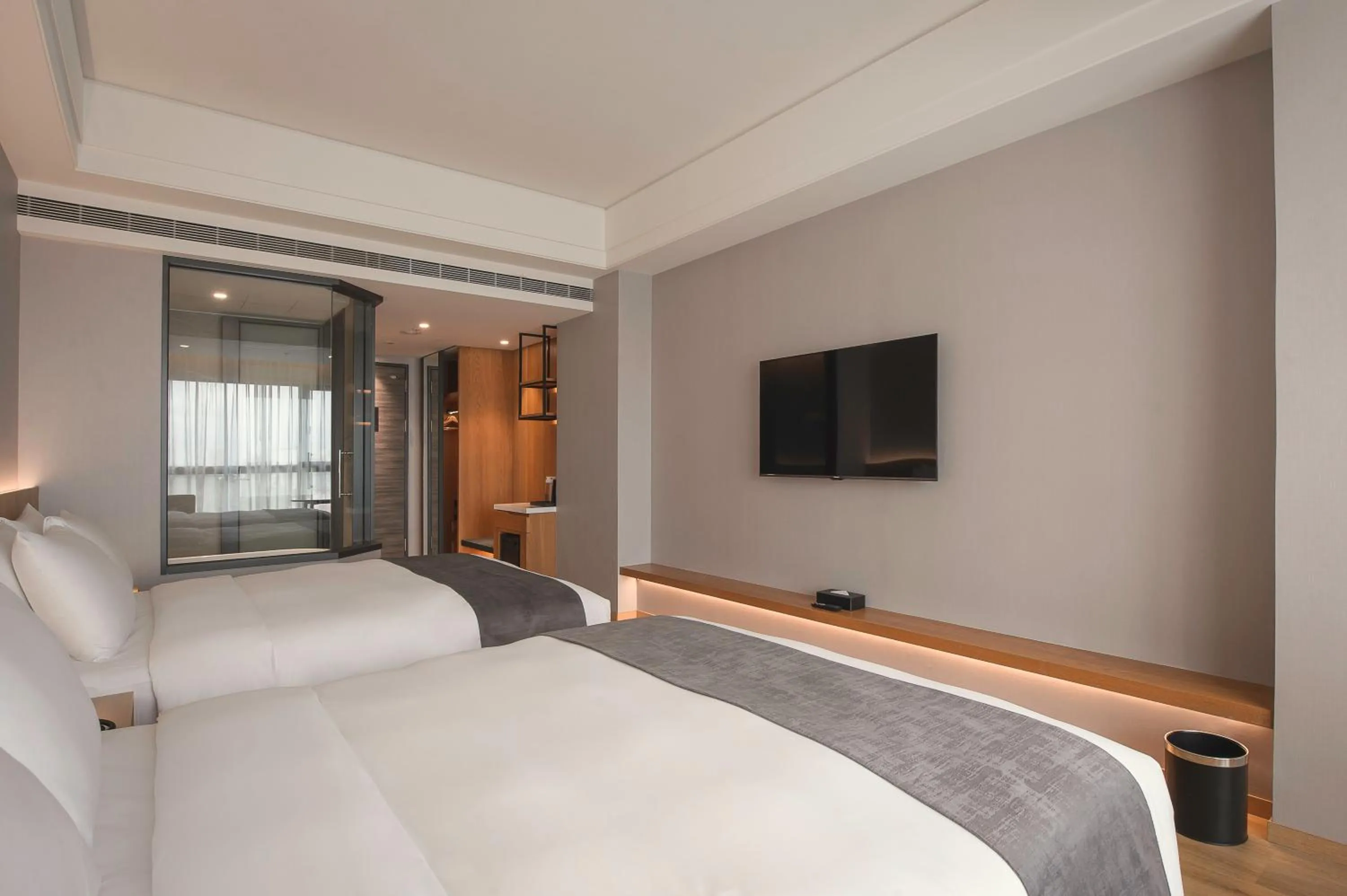 Bed in Grand Banyan Hotel