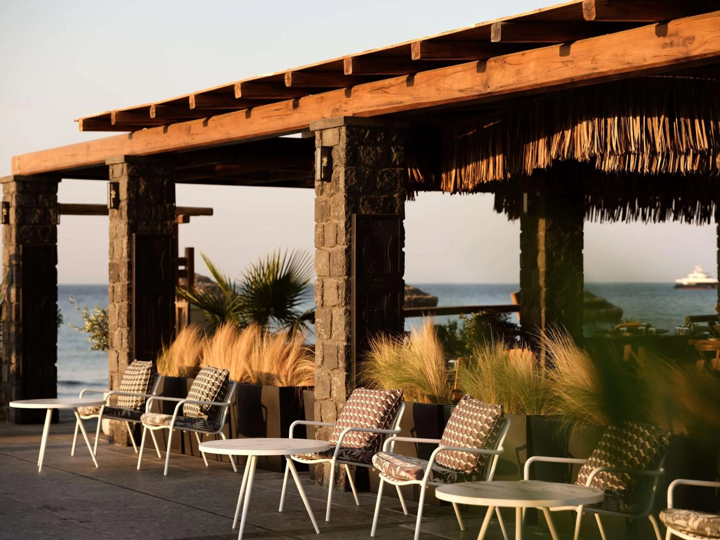 Patio in Sea Breeze Santorini Beach Resort, Curio By Hilton
