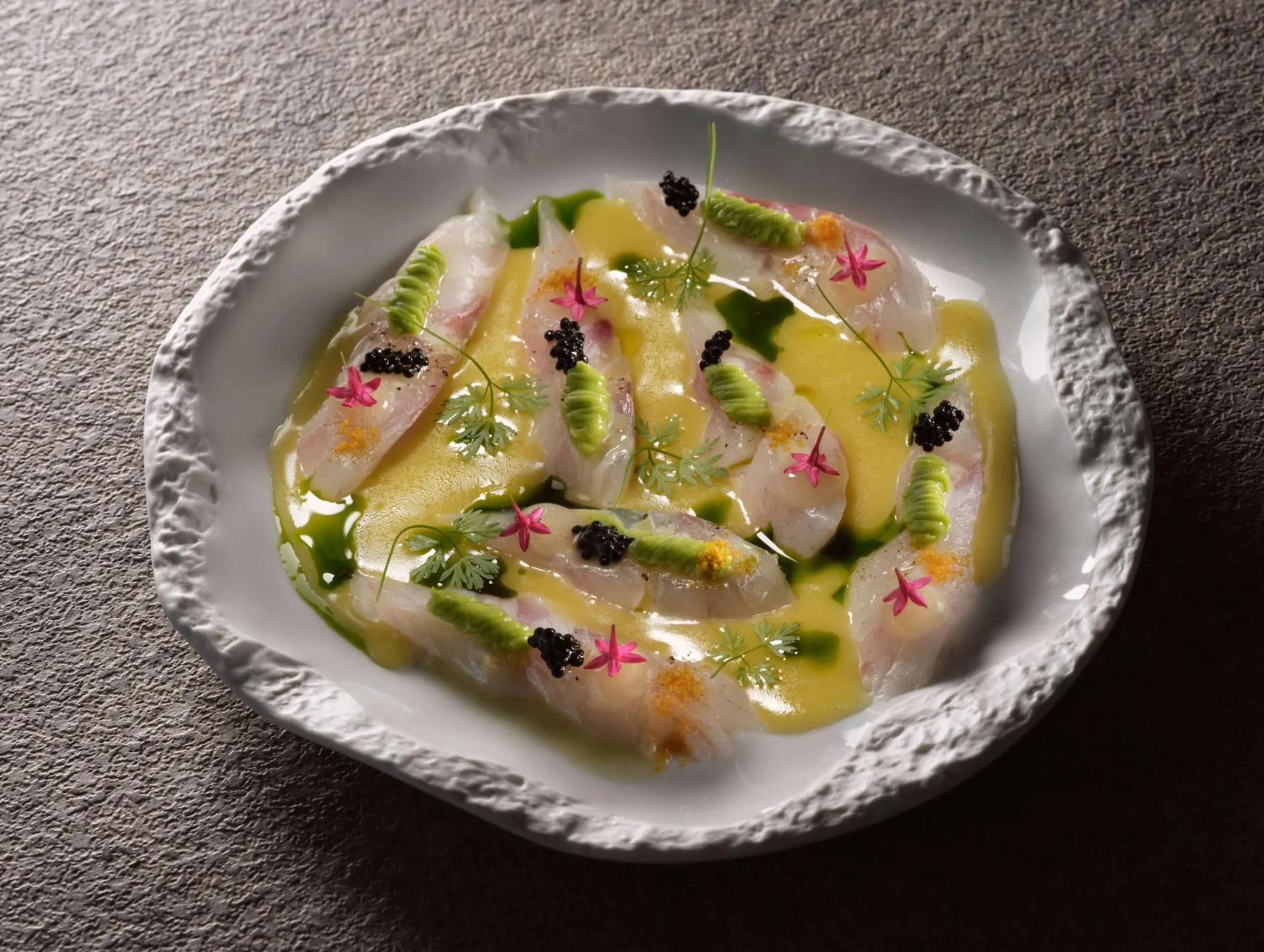 Dining area in Sea Breeze Santorini Beach Resort, Curio By Hilton