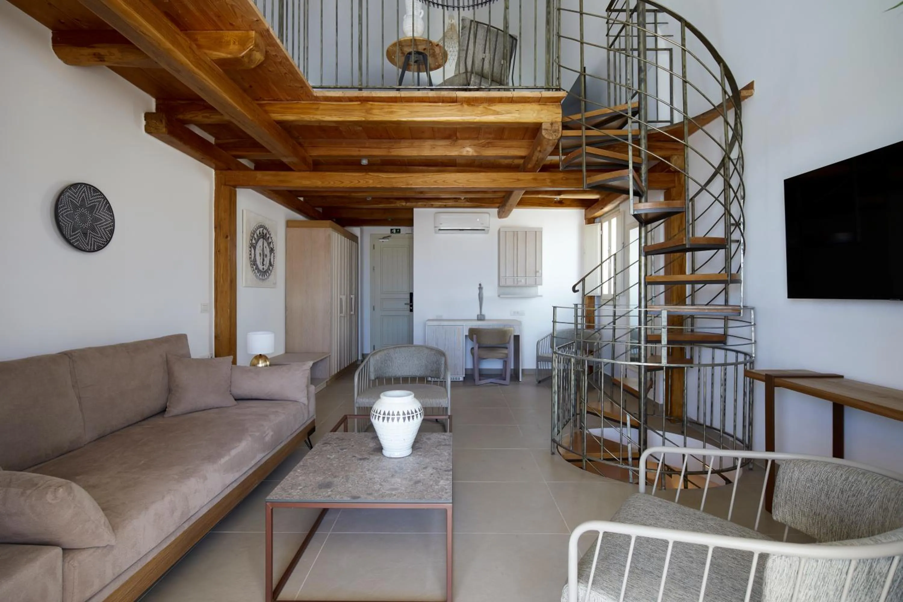 Living room in Sea Breeze Santorini Beach Resort, Curio By Hilton