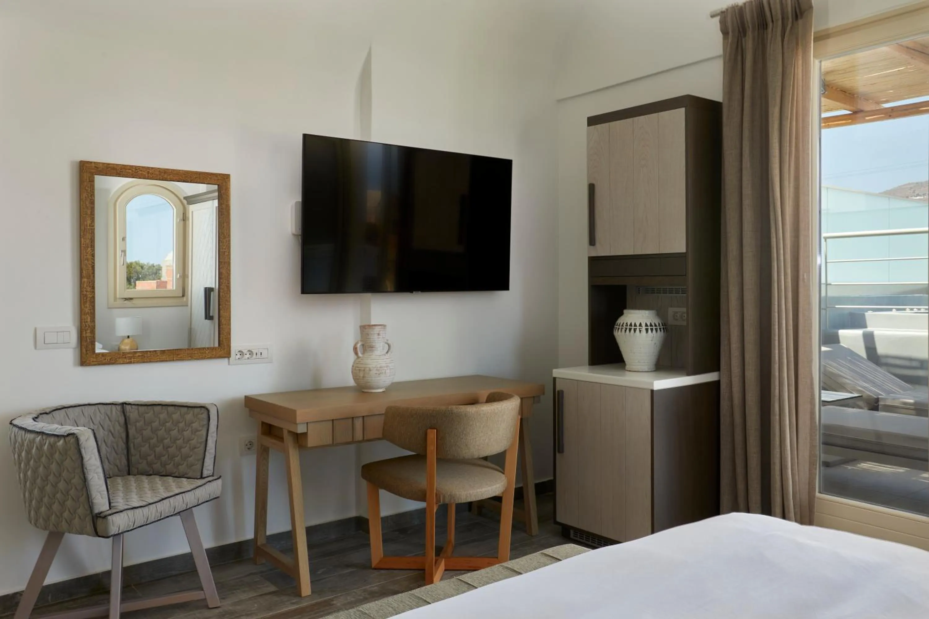 Bed in Sea Breeze Santorini Beach Resort, Curio By Hilton