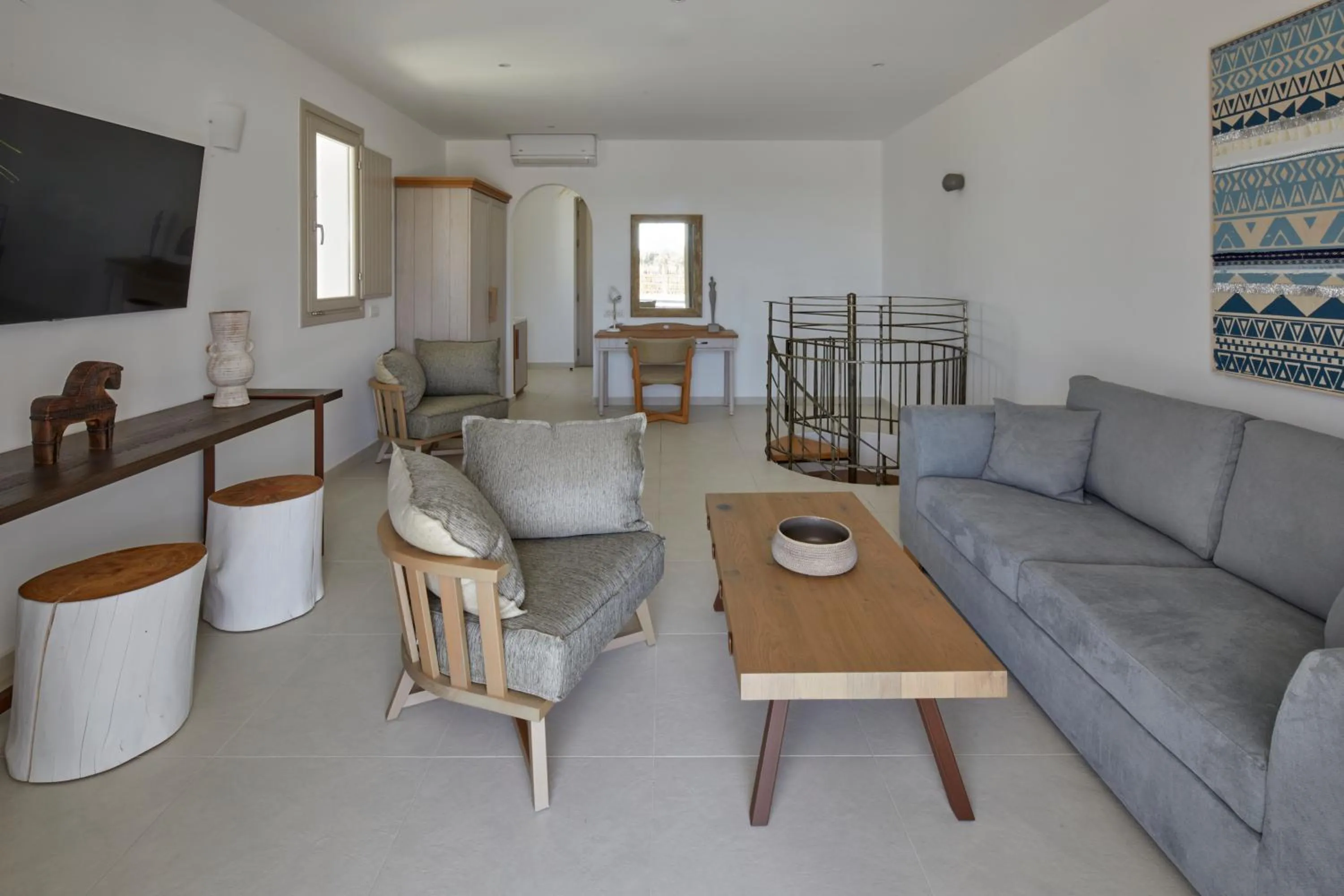 Living room in Sea Breeze Santorini Beach Resort, Curio By Hilton