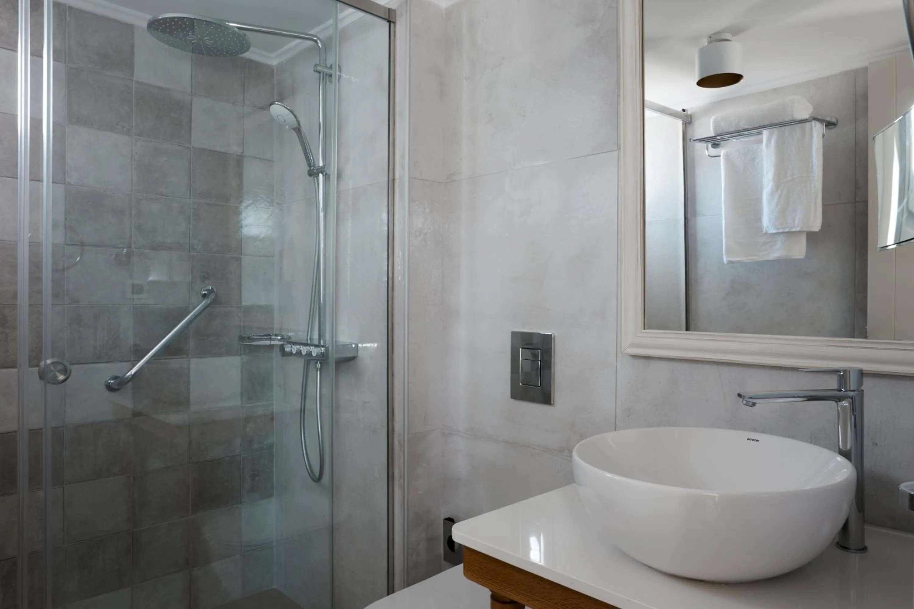 Shower in Sea Breeze Santorini Beach Resort, Curio By Hilton