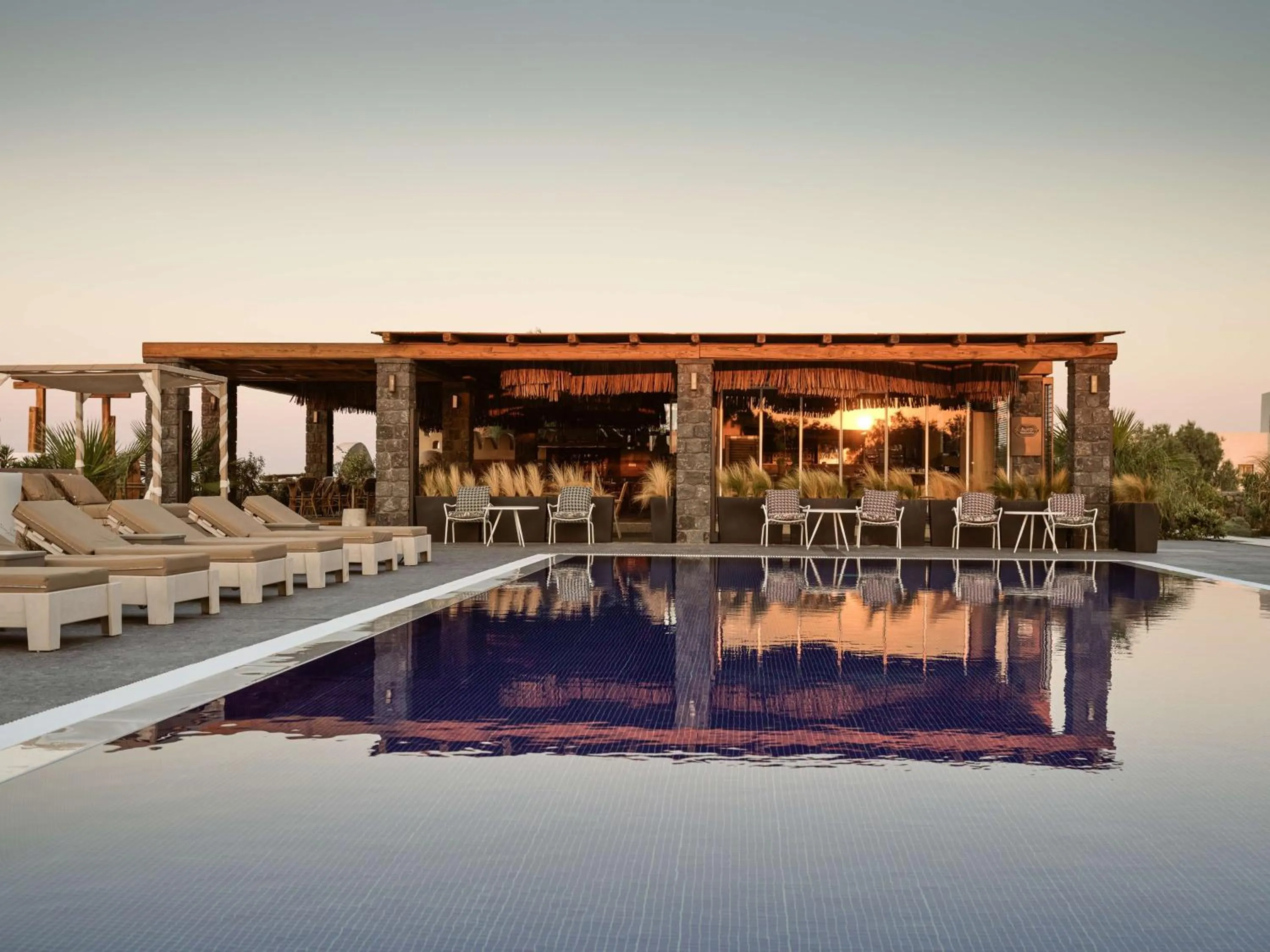 Pool view in Sea Breeze Santorini Beach Resort, Curio By Hilton