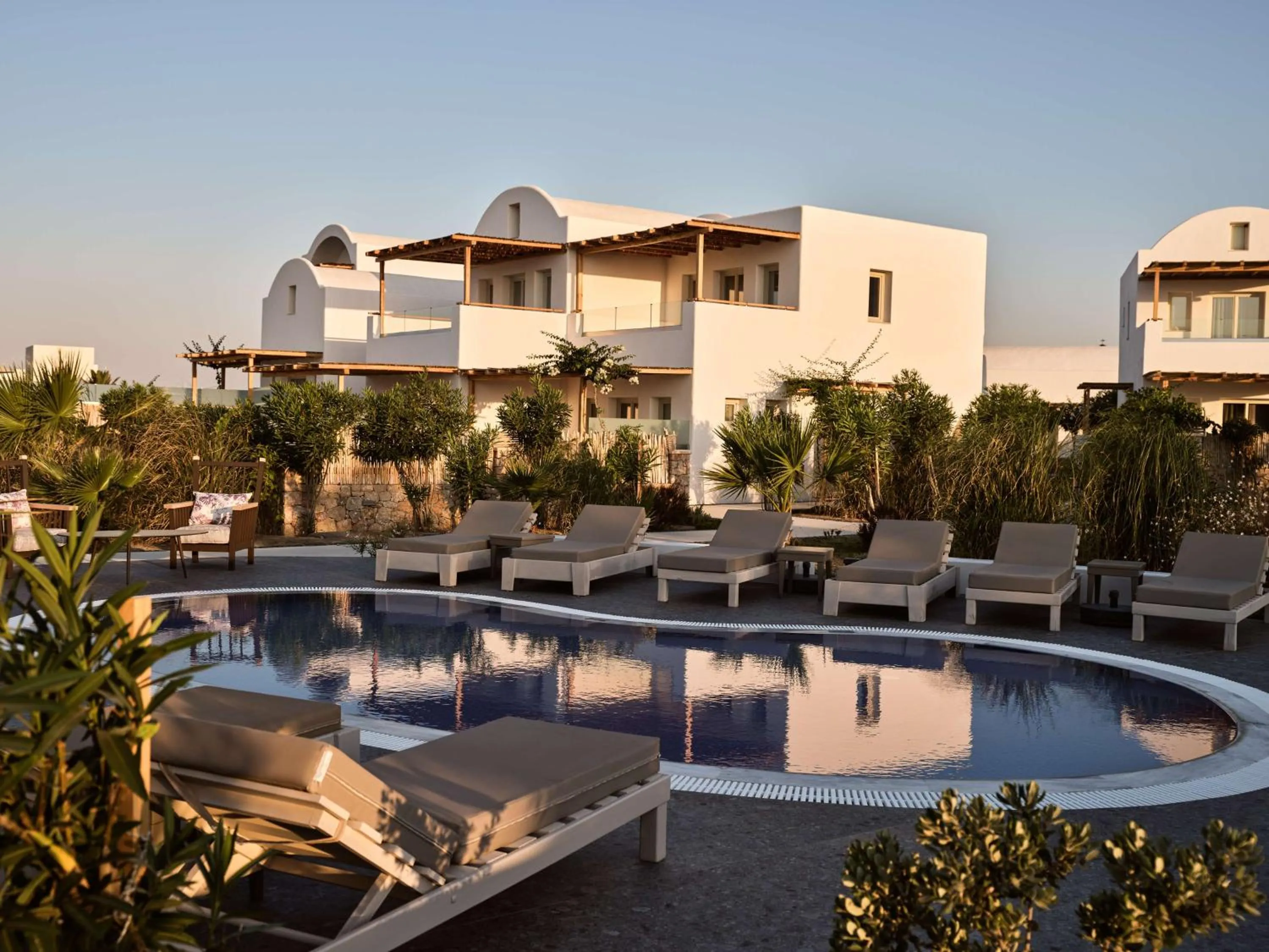 Pool view in Sea Breeze Santorini Beach Resort, Curio By Hilton