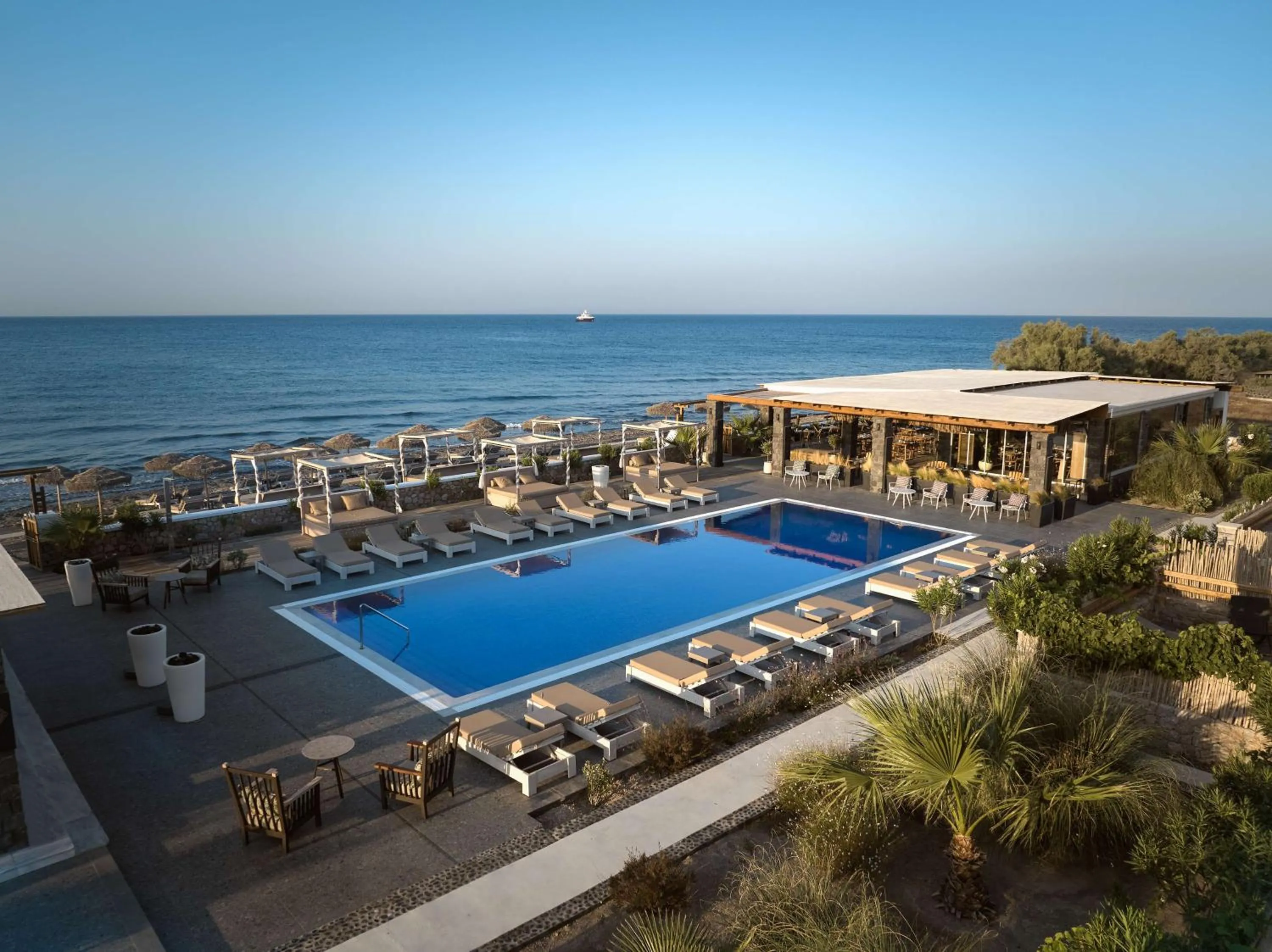 Pool view in Sea Breeze Santorini Beach Resort, Curio By Hilton