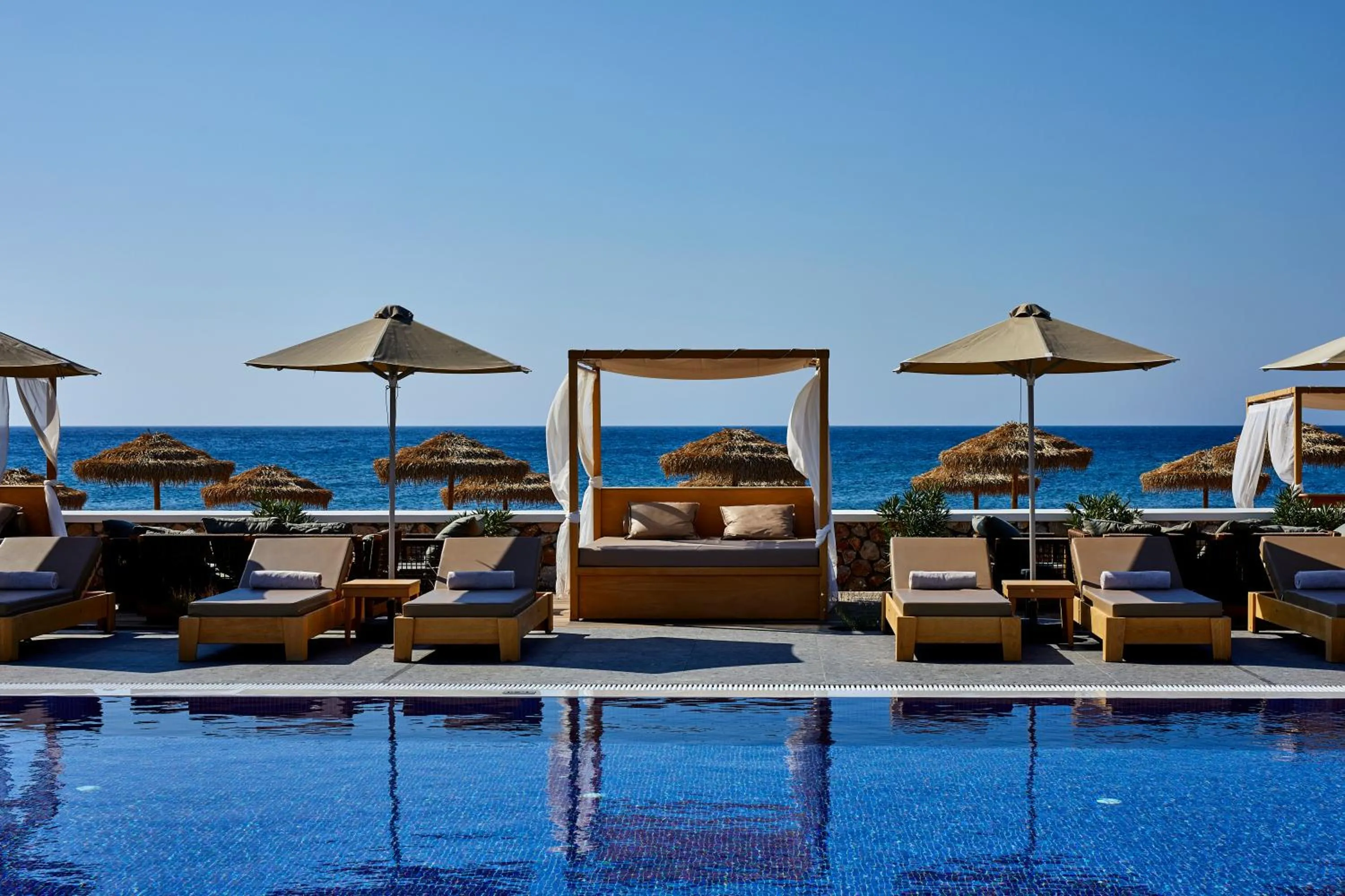 Swimming pool in Sea Breeze Santorini Beach Resort, Curio By Hilton