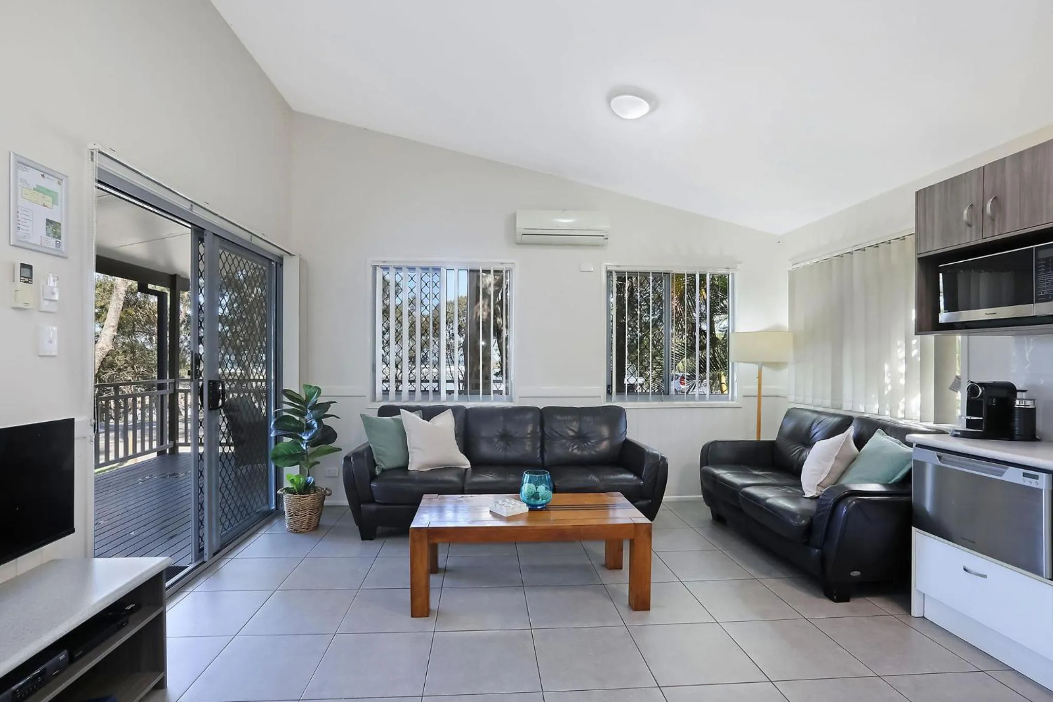 Living room in Reflections Moonee Beach - Holiday Park